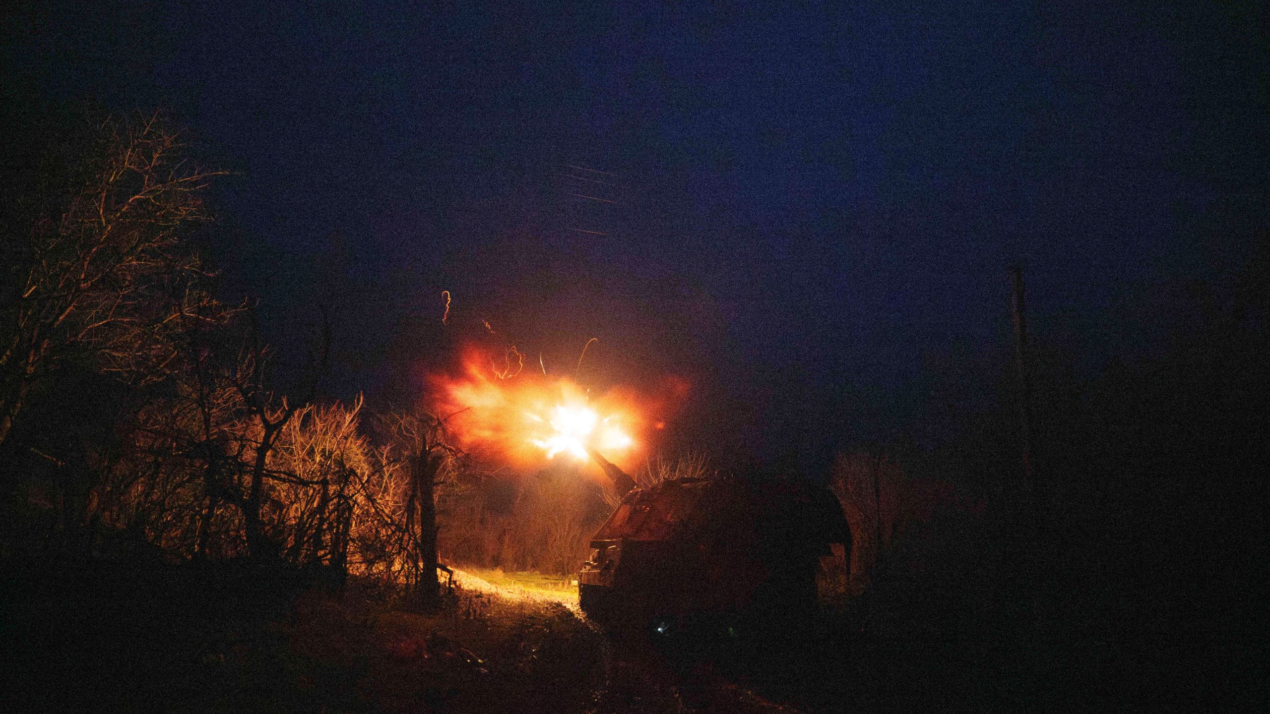 A Ukrainian AS-90 self-propelled artillery vehicle fires towards Russian positions at the frontline on Pokrovsk direction, Donetsk region, Ukraine, Wednesday, Dec. 23, 2024. (AP Photo/Evgeniy Maloletka)