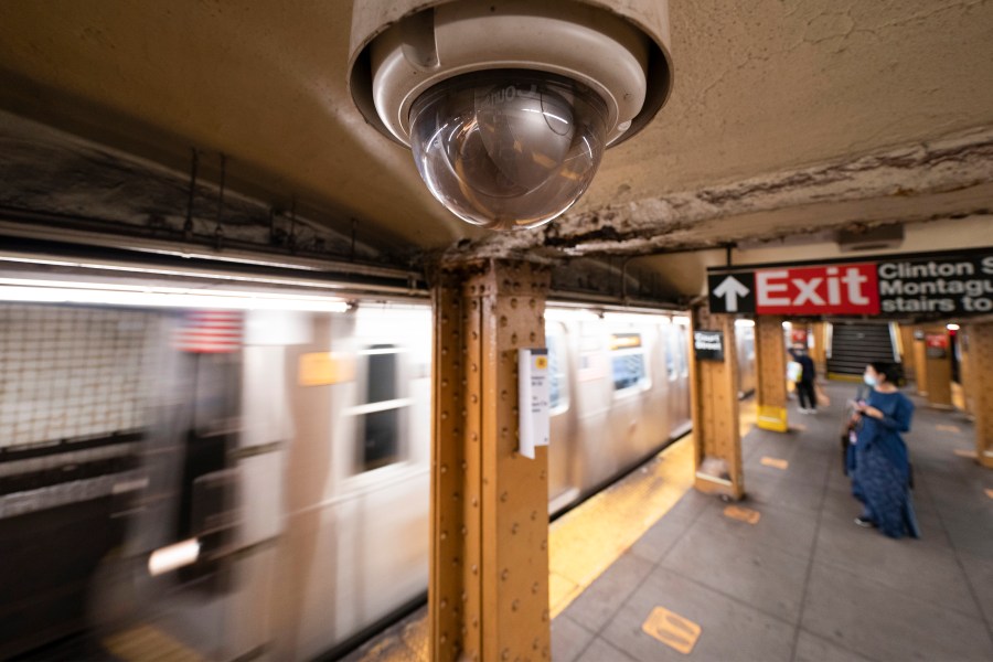 FILE - A video surveillance camera hangs from the ceiling above a subway platform, Oct. 7, 2020, in the Brooklyn borough of New York. (AP Photo/Mark Lennihan, File)