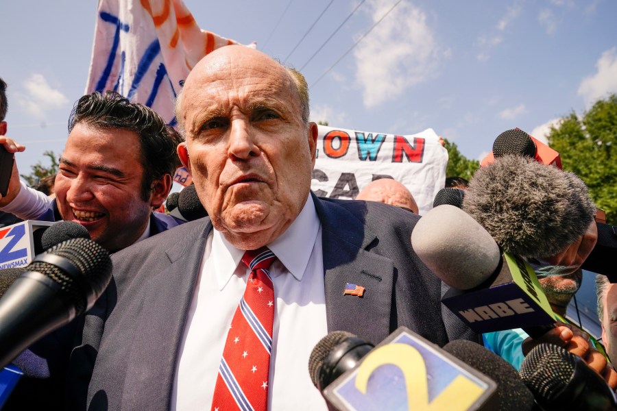 FILE - Rudy Giuliani speaks outside the Fulton County jail in Atlanta, on Wednesday, Aug. 23, 2023. (AP Photo/Brynn Anderson, File)