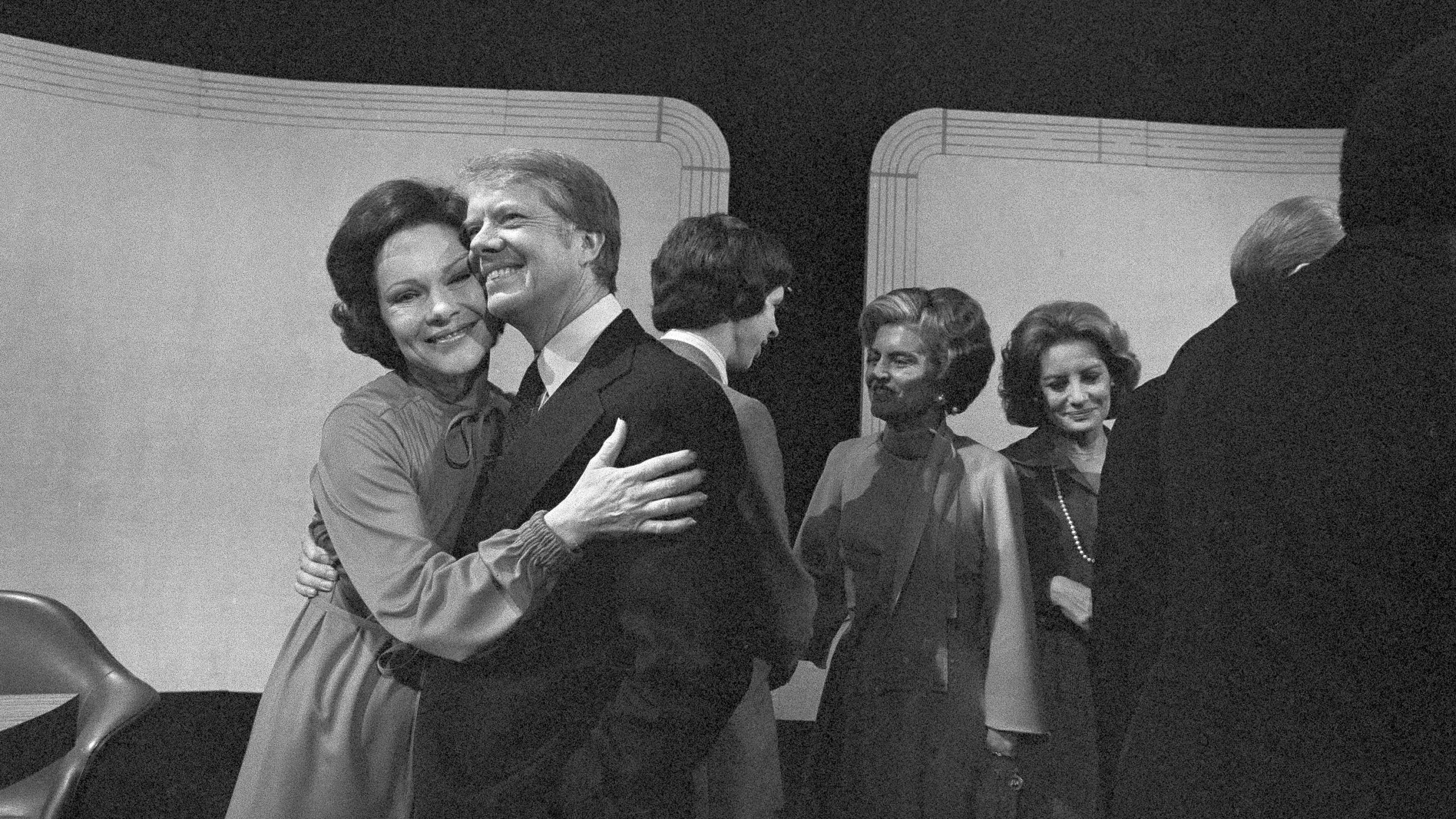 FILE - Democratic presidential candidate Jimmy Carter gets a hug from his wife, Rosalynn, after the third presidential debate on Oct. 22, 1976, Williamsburg, Va. (AP Photo, File)