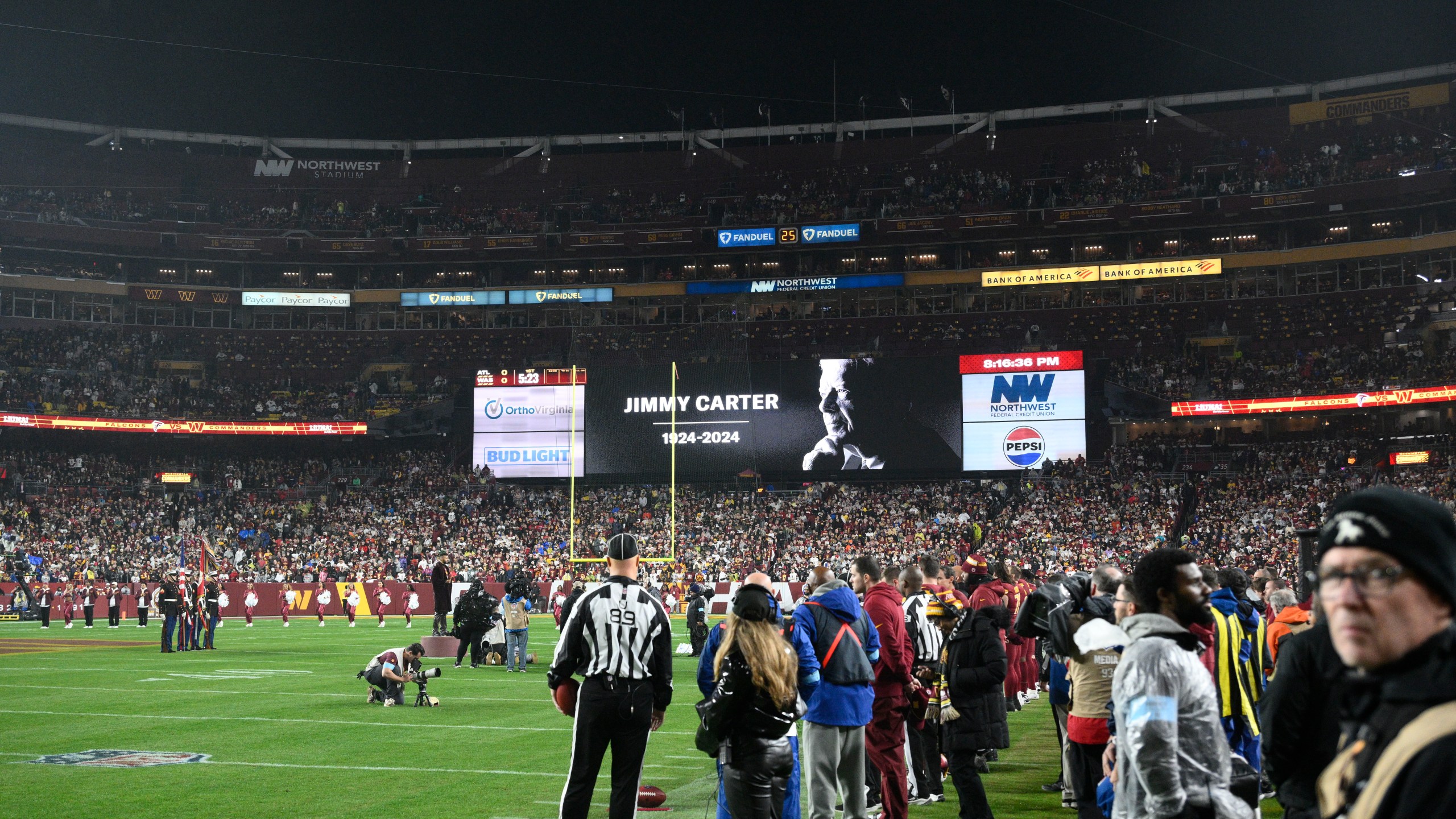 A video tribute to former President Jimmy Carter is seen before an NFL football game between the Washington Commanders and the Atlanta Falcons, Sunday, Dec. 29, 2024, in Landover. (AP Photo/Nick Wass)