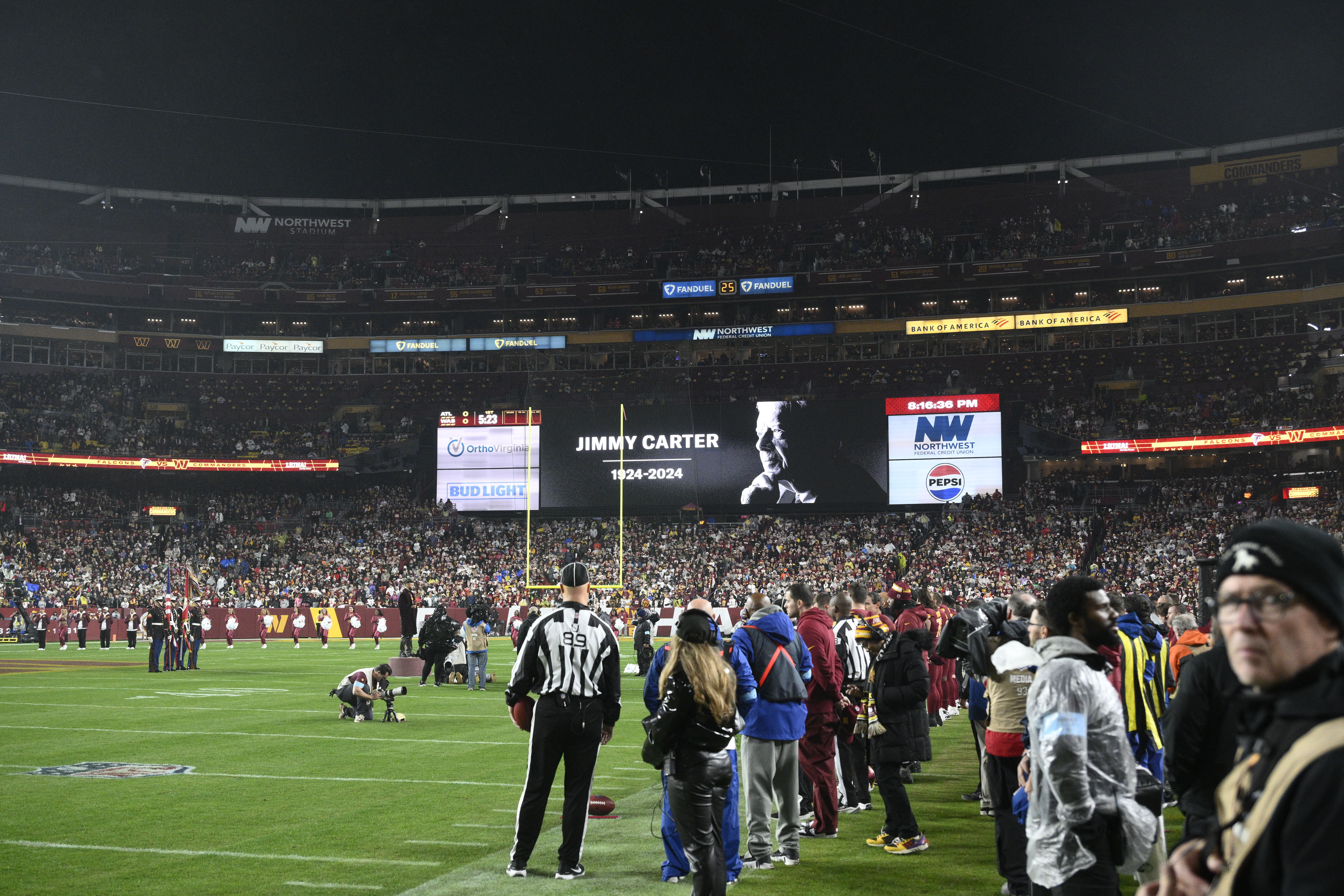 A video tribute to former President Jimmy Carter is seen before an NFL football game between the Washington Commanders and the Atlanta Falcons, Sunday, Dec. 29, 2024, in Landover. (AP Photo/Nick Wass)