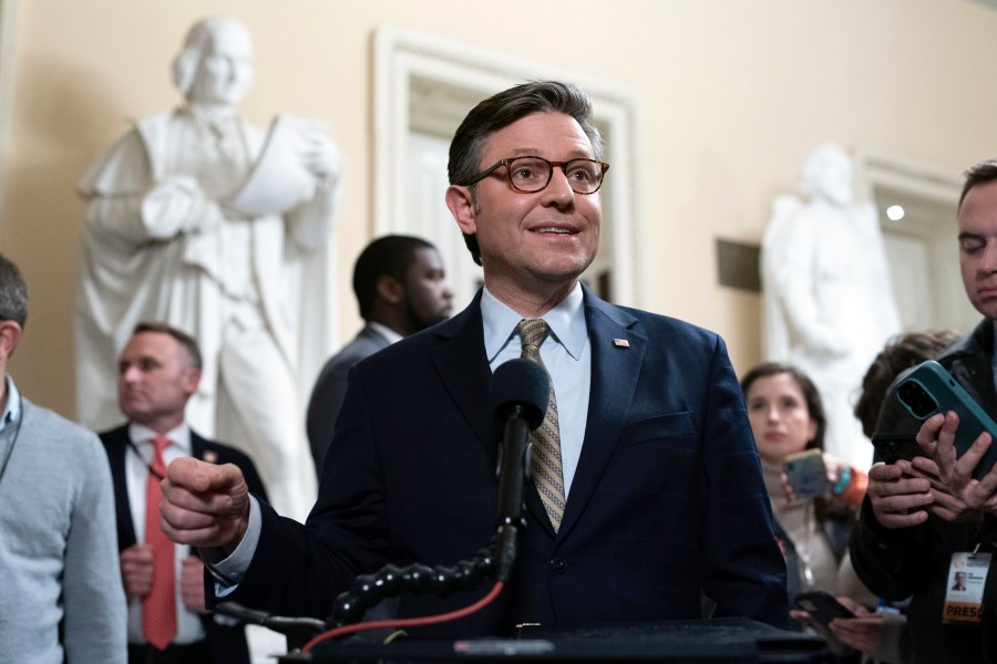 Speaker of the House Mike Johnson, R-La., talks to reporters after passing the funding bill to avert the government shutdown at the Capitol in Washington, Friday, Dec. 20, 2024. (AP Photo/Jose Luis Magana)