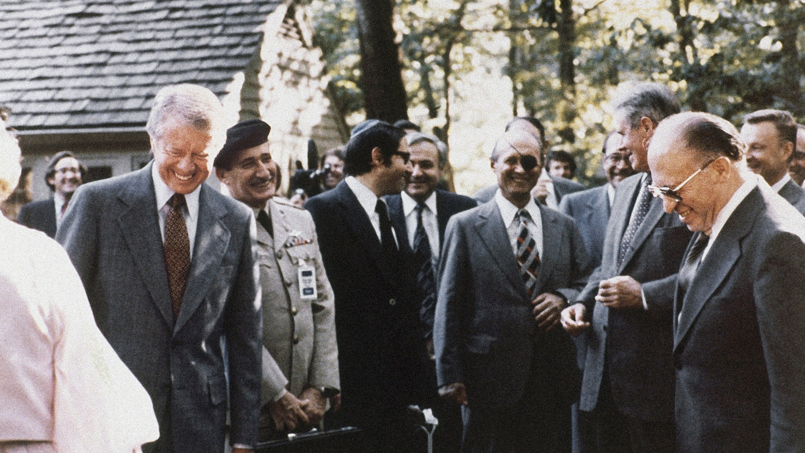 FILE - President Jimmy Carter, Israeli Premier Menachem Begin and Egyptian President Anwar Sadat gather with their aides during discussions on Middle East problems at Camp David, Md., in September 1978. (AP Photo, File)