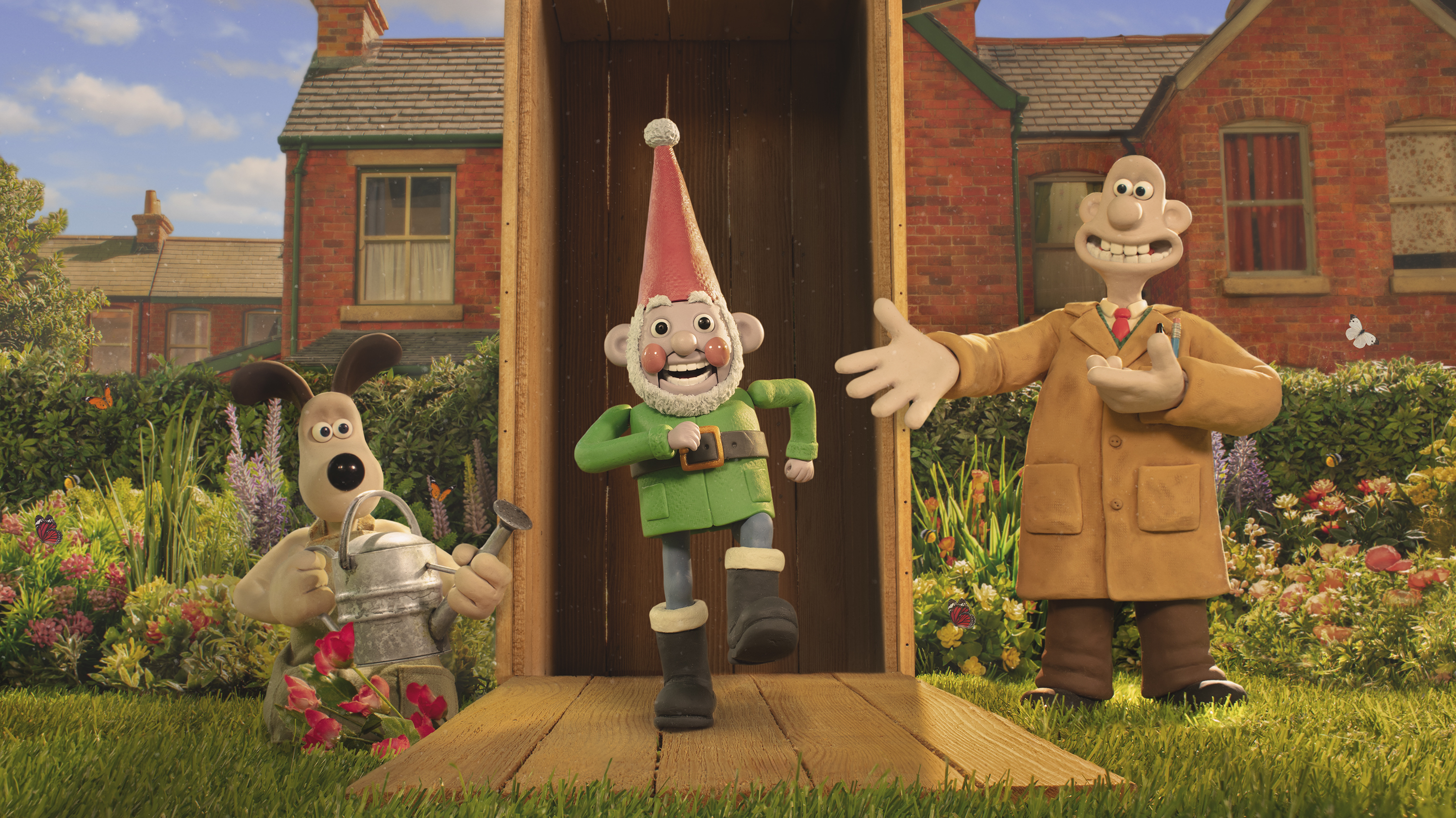 This image released by Netflix shows the characters Gromit, left, and Wallace, voiced by Ben Whitehead, right, with their robot knome, Norbot, voiced by Reece Shearsmith, in a scene from the film "Wallace & Gromit: Vengeance Most Fowl." (Netflix via AP)