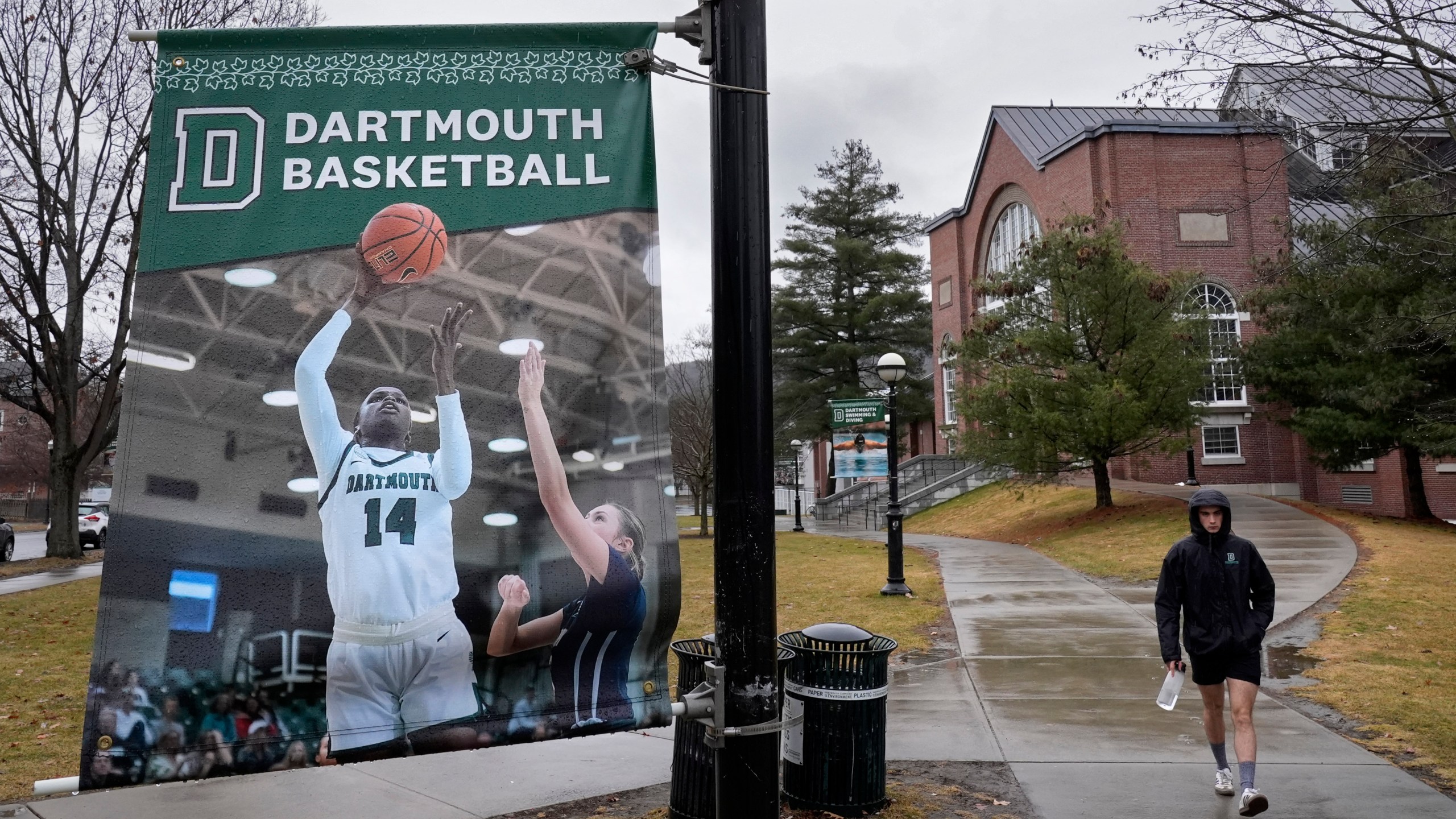 FILE - A student walks near the Alumni Gymnasium on the campus of Dartmouth College, March 5, 2024, in Hanover, N.H. (AP Photo/Robert F. Bukaty, File)