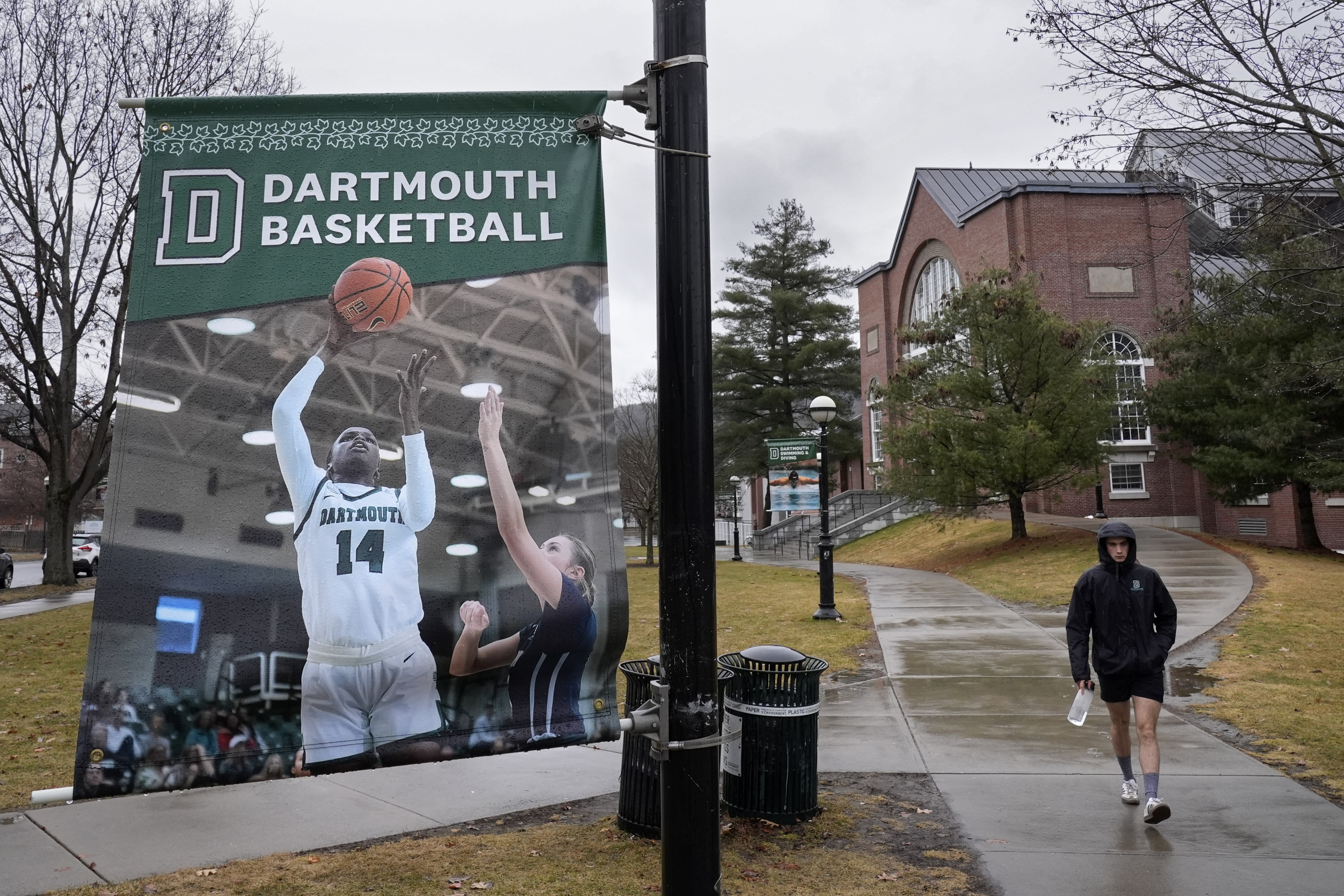 FILE - A student walks near the Alumni Gymnasium on the campus of Dartmouth College, March 5, 2024, in Hanover, N.H. (AP Photo/Robert F. Bukaty, File)