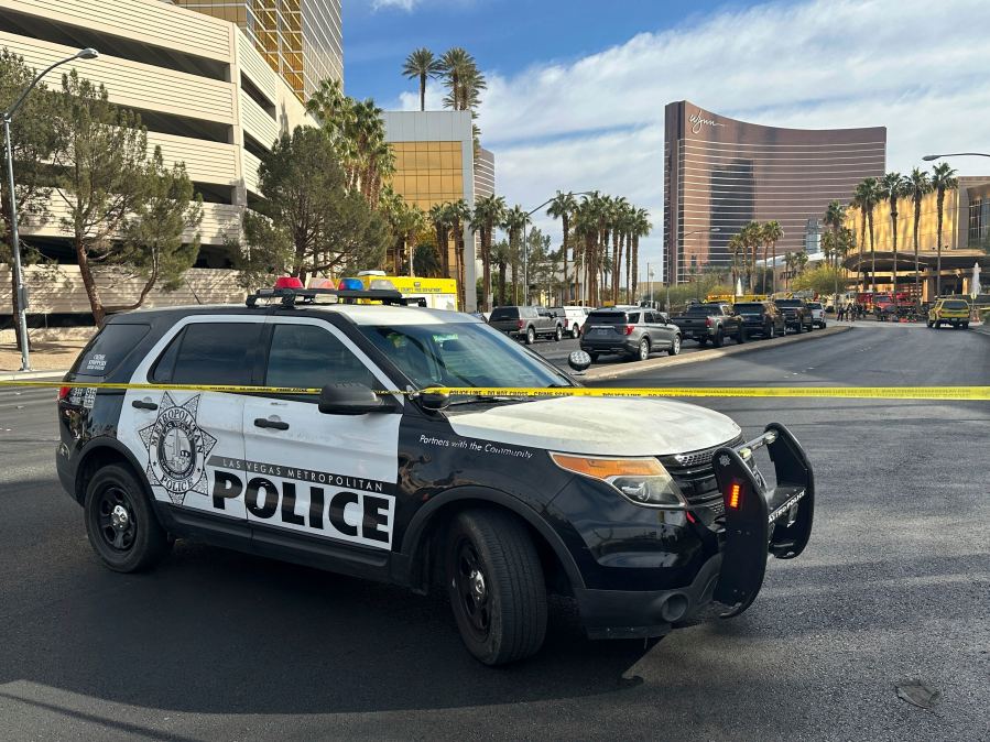 Police block the area after a vehicle caught fire and exploded outside the lobby of President-elect Donald Trump's hotel Wednesday, Jan. 1, 2025. (AP Photo/Ty ONeil)