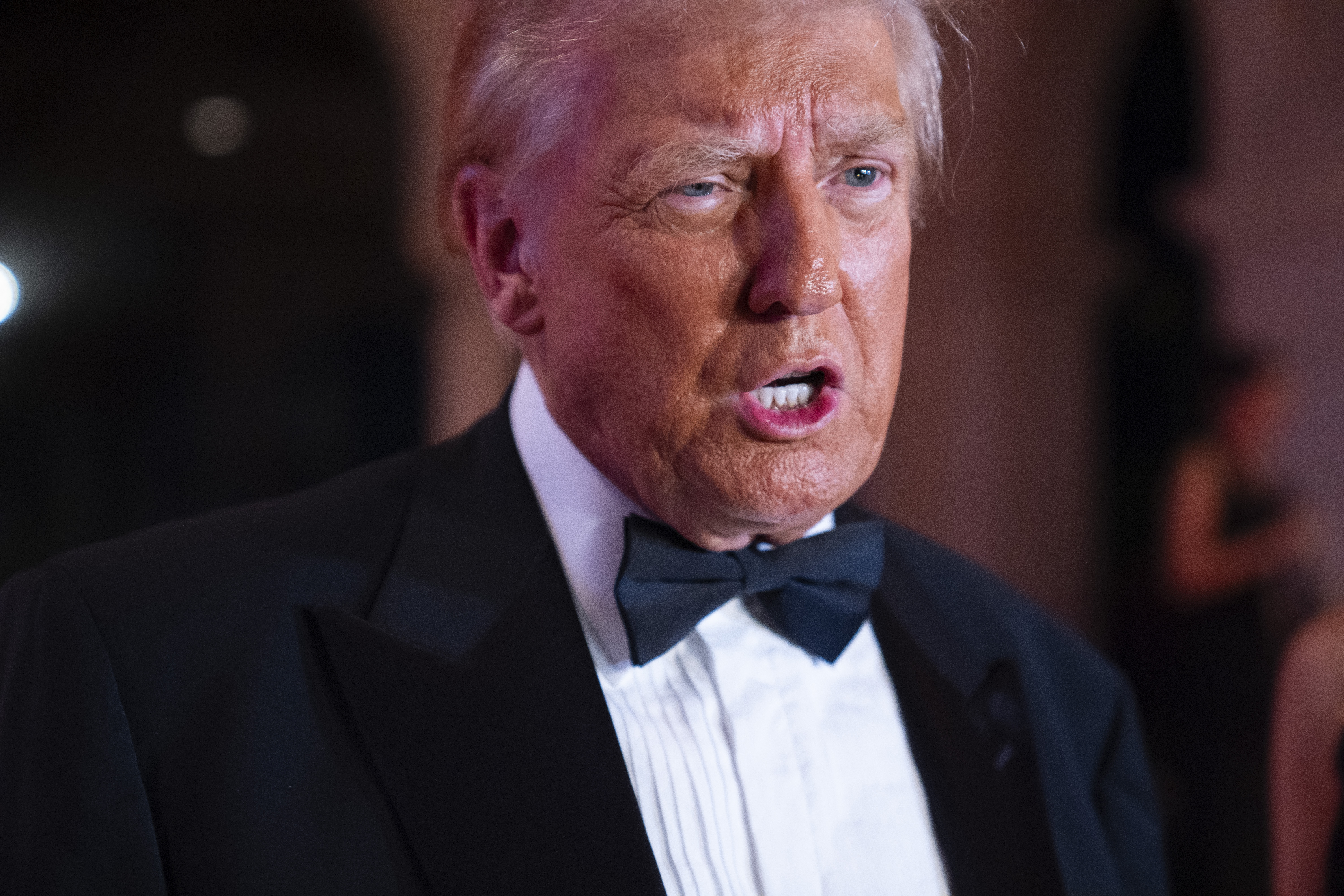 President-elect Donald Trump speaks to reporters before a New Year's Eve party at Mar-a-Lago, Tuesday, Dec. 31, 2024, in Palm Beach, Fla. (AP Photo/Evan Vucci)