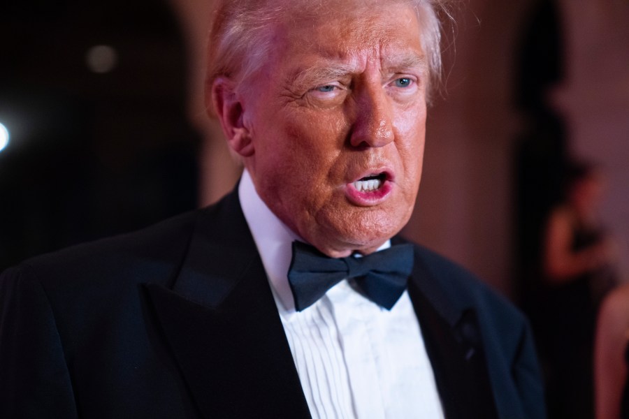 President-elect Donald Trump speaks to reporters before a New Year's Eve party at Mar-a-Lago, Tuesday, Dec. 31, 2024, in Palm Beach, Fla. (AP Photo/Evan Vucci)