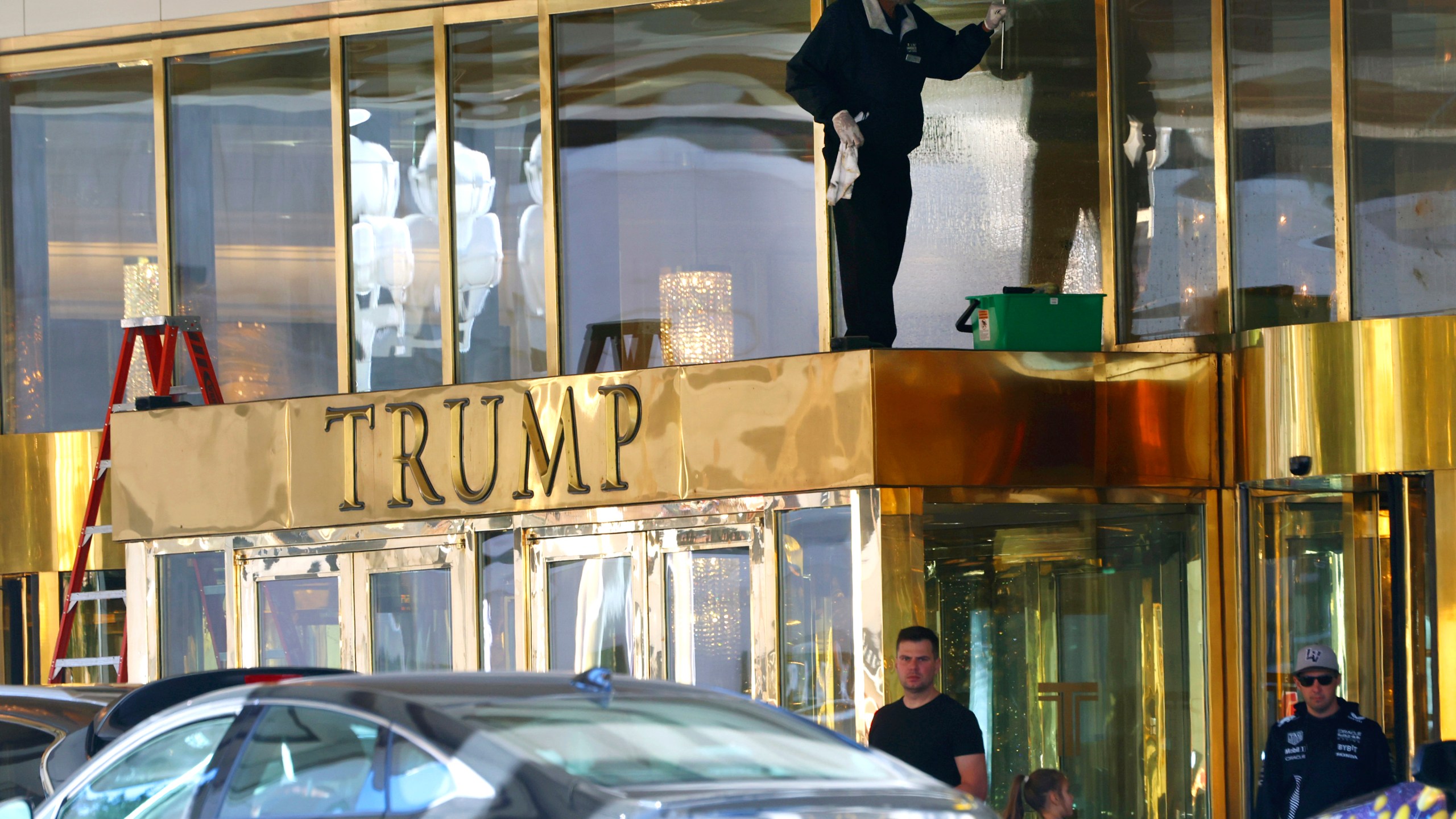 A worker cleans glass windows at Trump International Hotel, on Thursday, Jan. 2, 2025, in Las Vegas. (Bizuayehu Tesfaye/Las Vegas Review-Journal via AP)