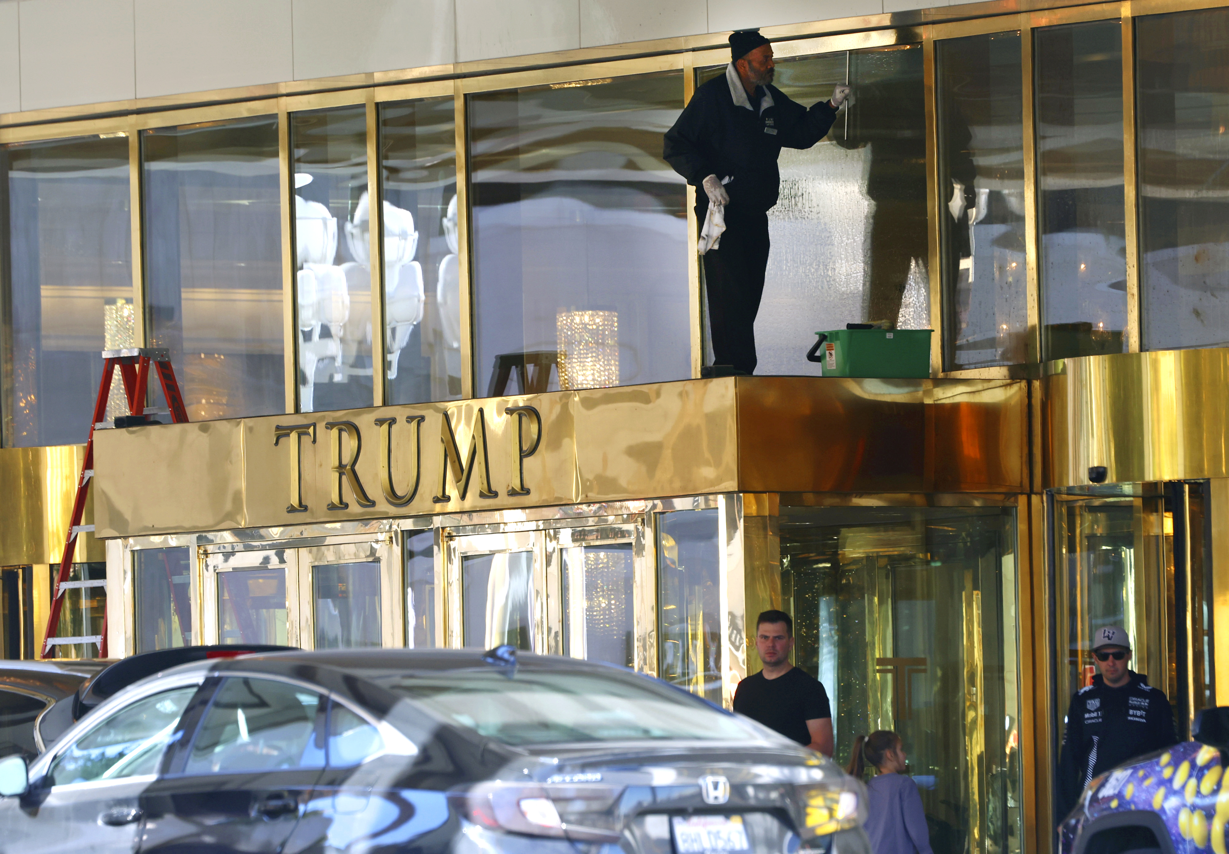 A worker cleans glass windows at Trump International Hotel, on Thursday, Jan. 2, 2025, in Las Vegas. (Bizuayehu Tesfaye/Las Vegas Review-Journal via AP)