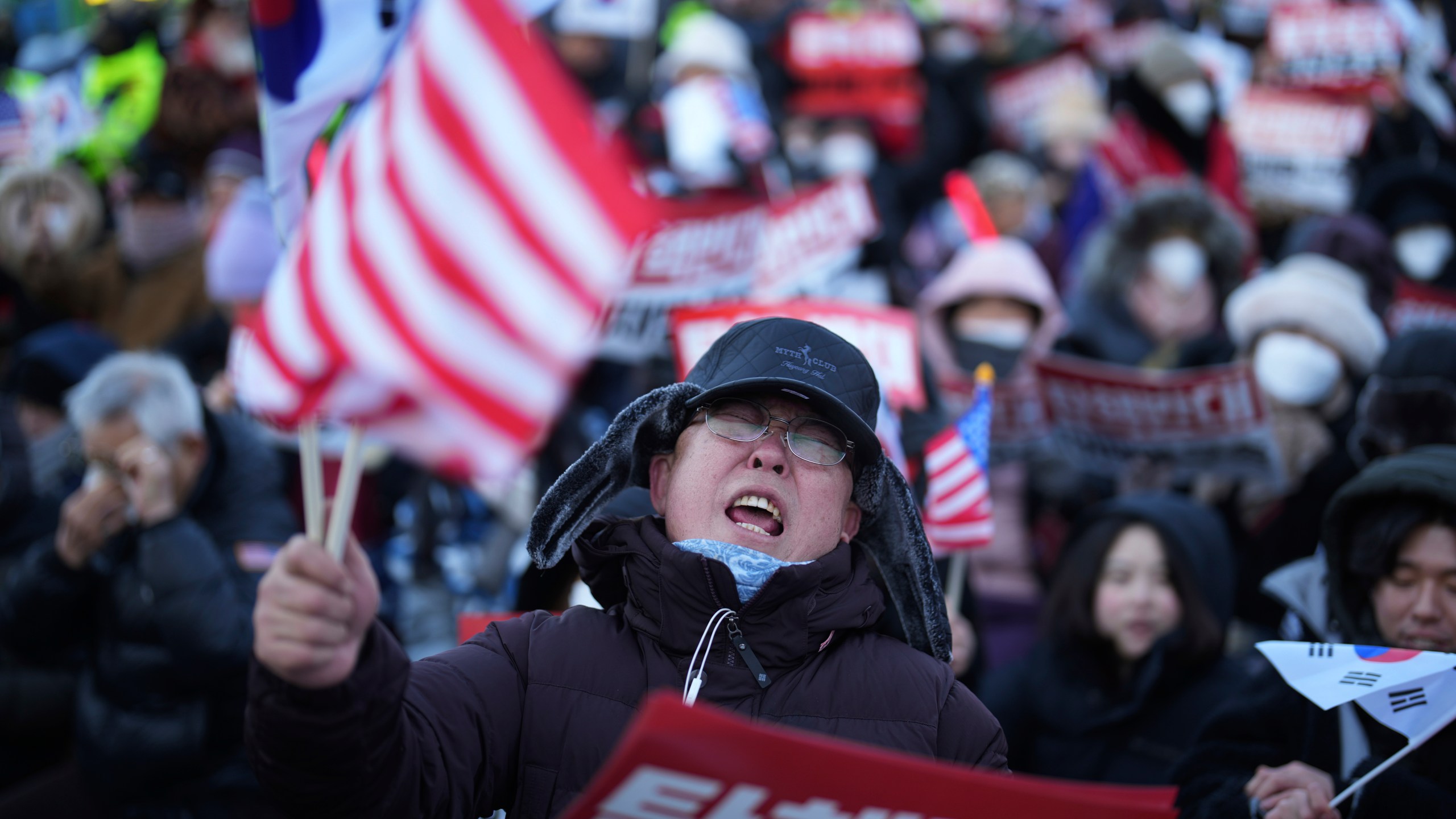 Supporters of impeached South Korean President Yoon Suk Yeol stage a rally to oppose a court having issued a warrant to detain Yoon, near the presidential residence in Seoul, South Korea, Friday, Jan. 3, 2025. The letters read, "Oppose Impeachment." (AP Photo/Lee Jin-man)