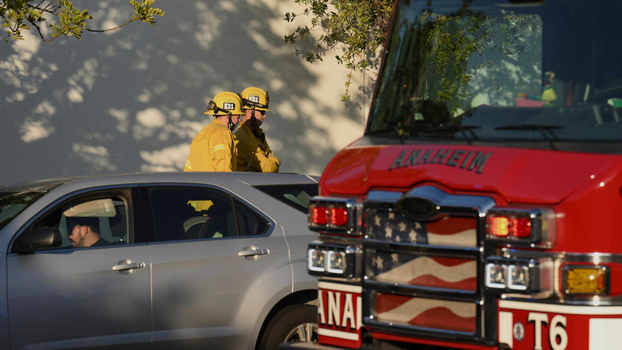 Firefighter stage outside a building where a plane crash occurred Thursday, Jan. 2, 2025, in Fullerton, Calif. (AP Photo/Kyusung Gong)