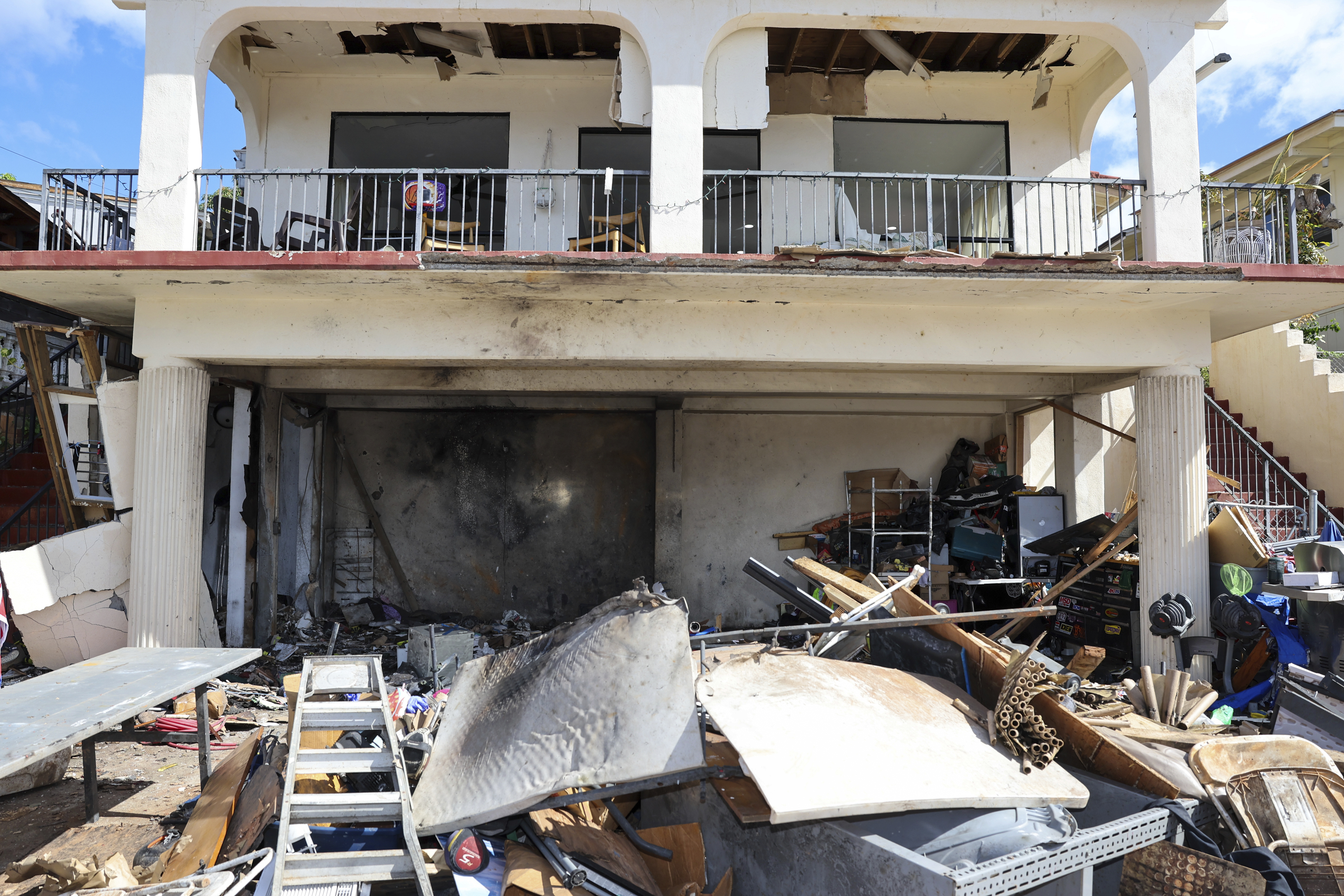 A view of the home where a New Year's Eve fireworks explosion killed and injured people, Wednesday, Jan. 1, 2025, in Honolulu. (AP Photo/Marco Garcia)