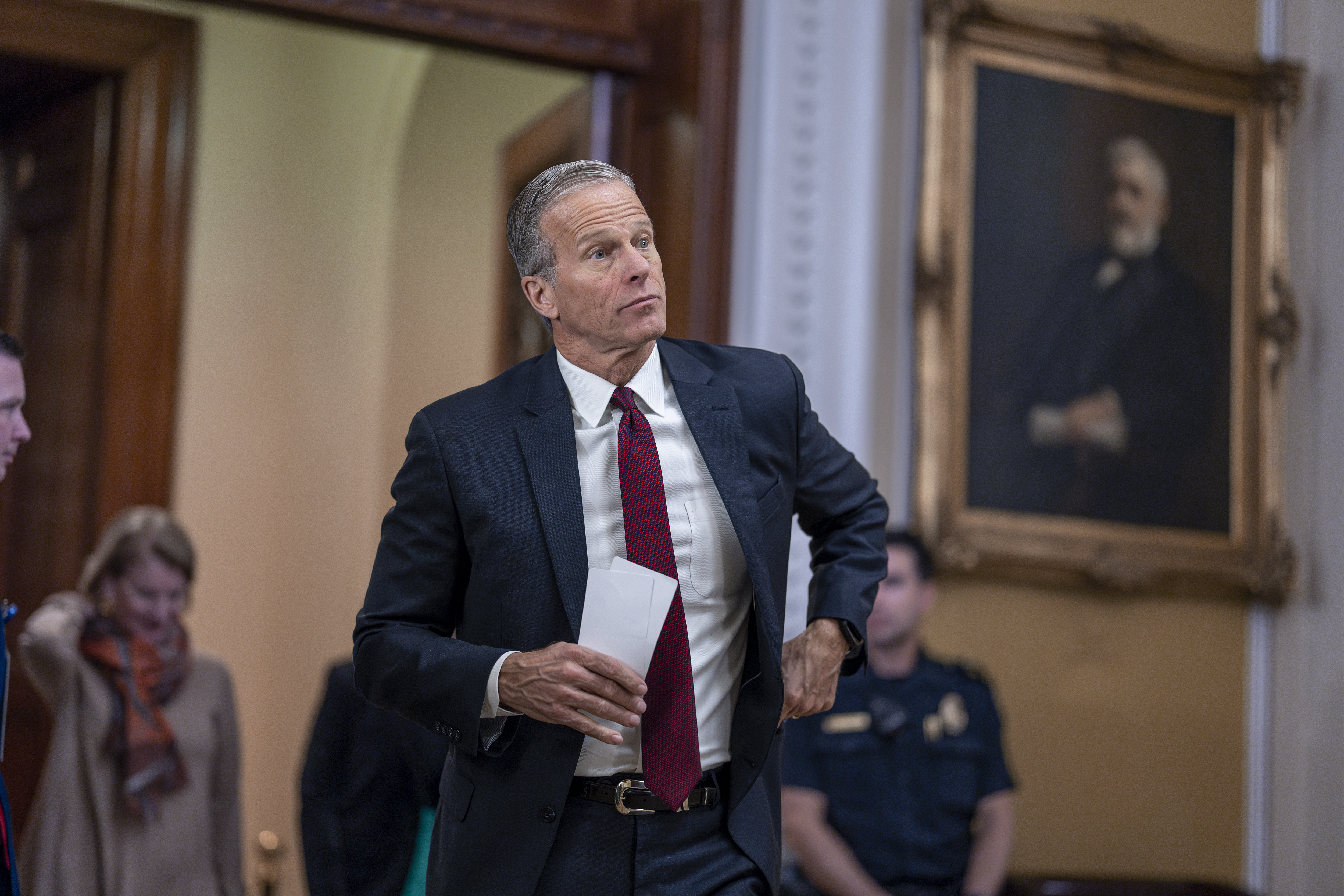 Senate Minority Whip John Thune, R-S.D., arrives to speak to reporters following a closed-door strategy session, at the Capitol in Washington, Tuesday, Dec. 17, 2024. (AP Photo/J. Scott Applewhite)