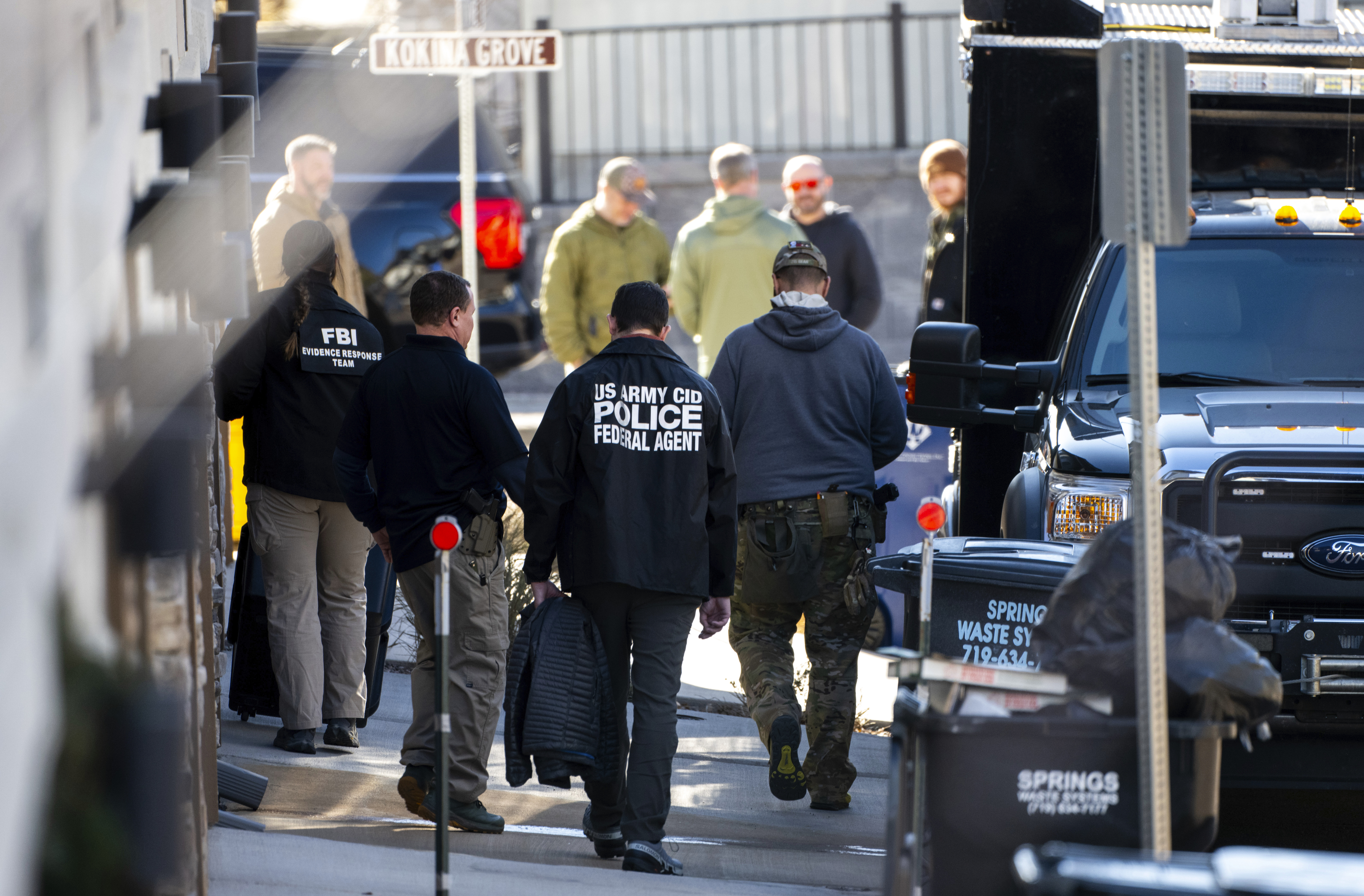 Investigators search a townhouse in northeastern Colorado Springs, Colo., Thursday, Jan. 2, 2025, as the investigation connected to the explosion of a Tesla Cybertruck outside President-elect Donald Trump's Las Vegas hotel continues. (Parker Seibold /The Gazette via AP)