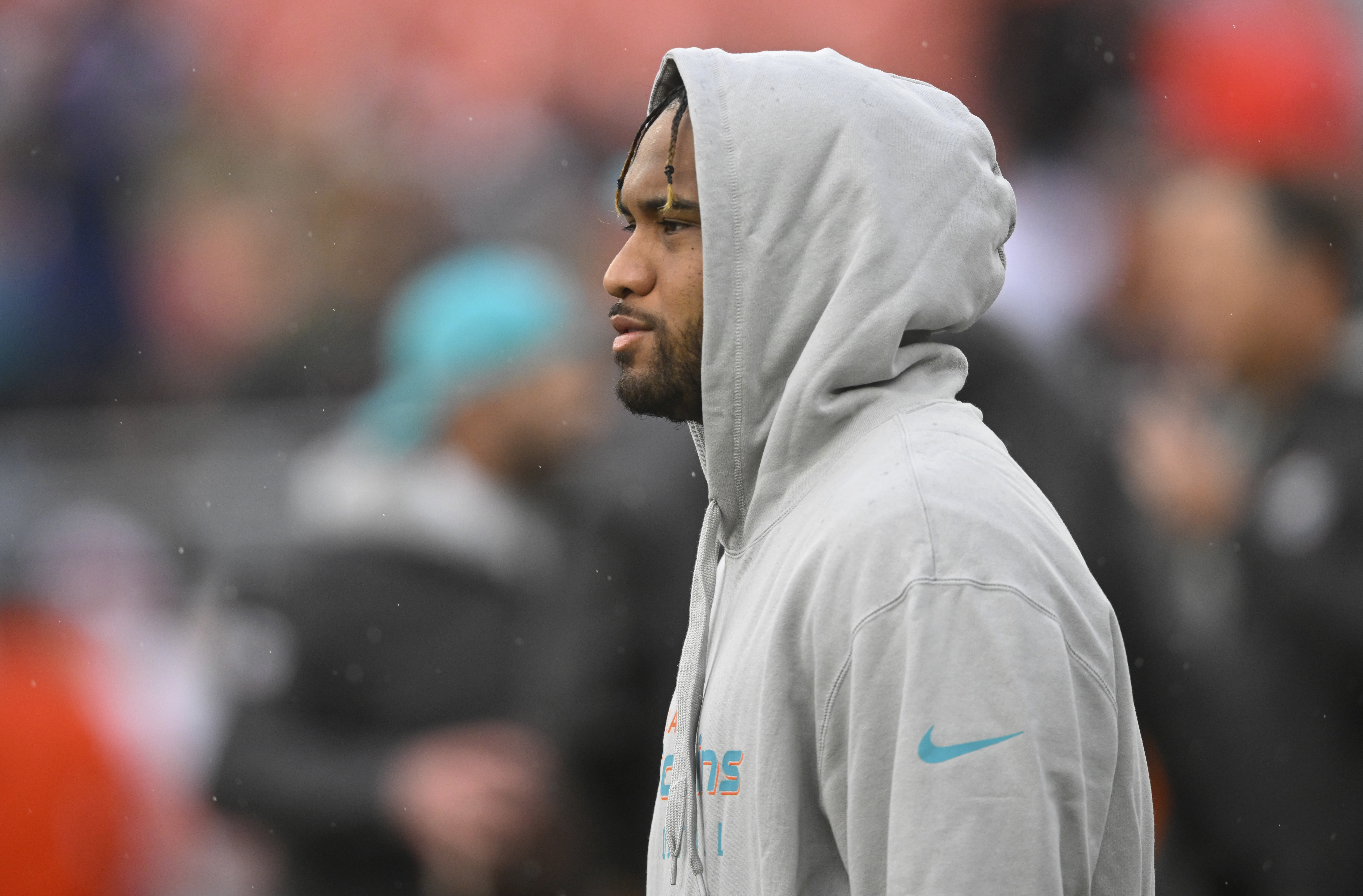 Miami Dolphins quarterback Tua Tagovailoa stands on the field before an NFL football game against the Cleveland Browns Sunday, Dec. 29, 2024, in Cleveland. (AP Photo/David Richard)