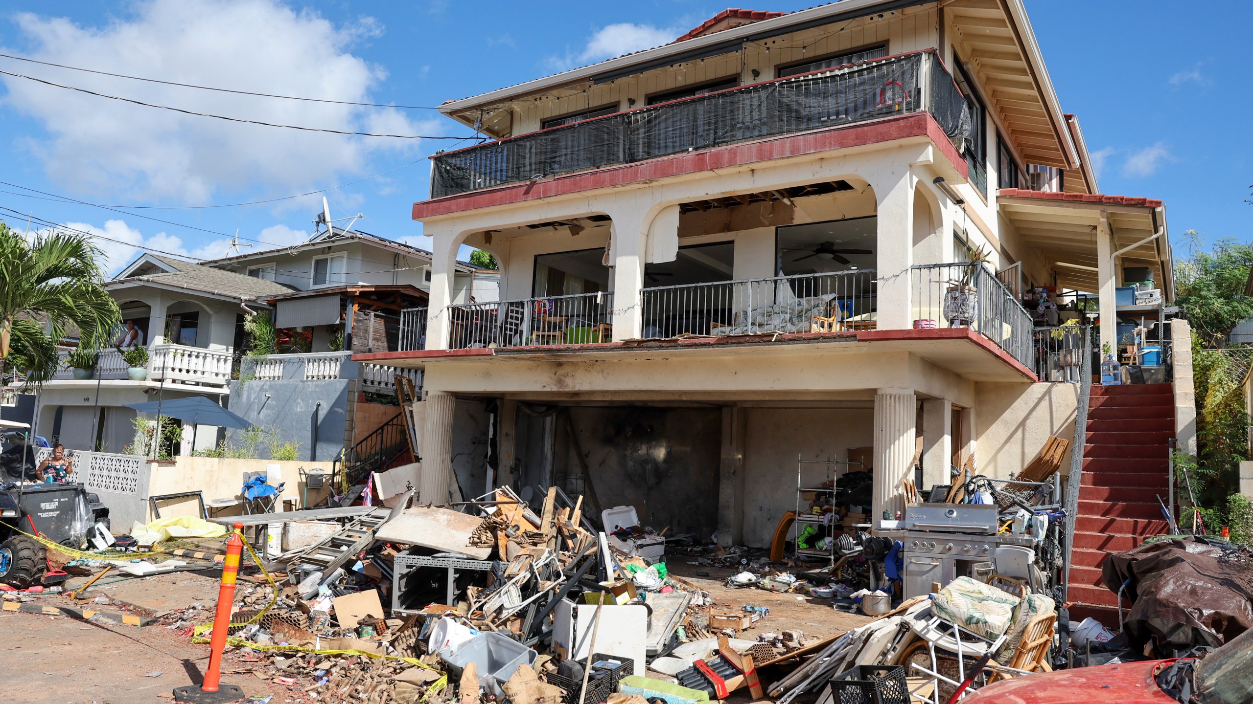 A view of the home where a New Year's Eve fireworks explosion killed and injured people, Wednesday, Jan. 1, 2025, in Honolulu. (AP Photo/Marco Garcia)