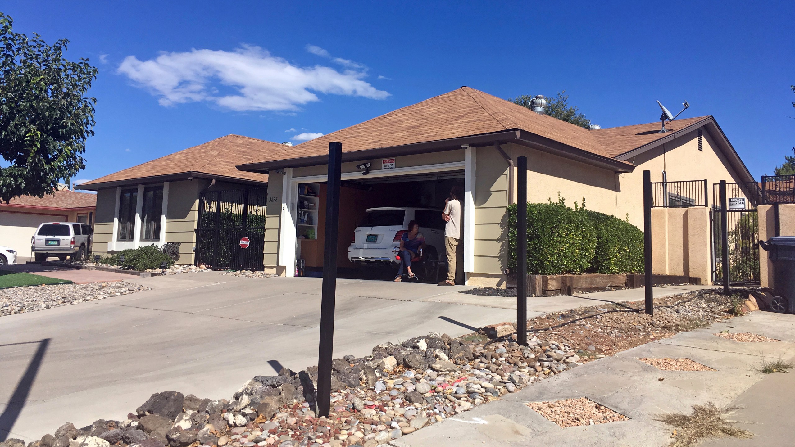 FILE - Poles for a new fence stand outside the house used in the AMC-TV series "Breaking Bad" in Albuquerque, N.M., on Friday, Oct. 13, 2017. (AP Photo/Russell Contreras, File)