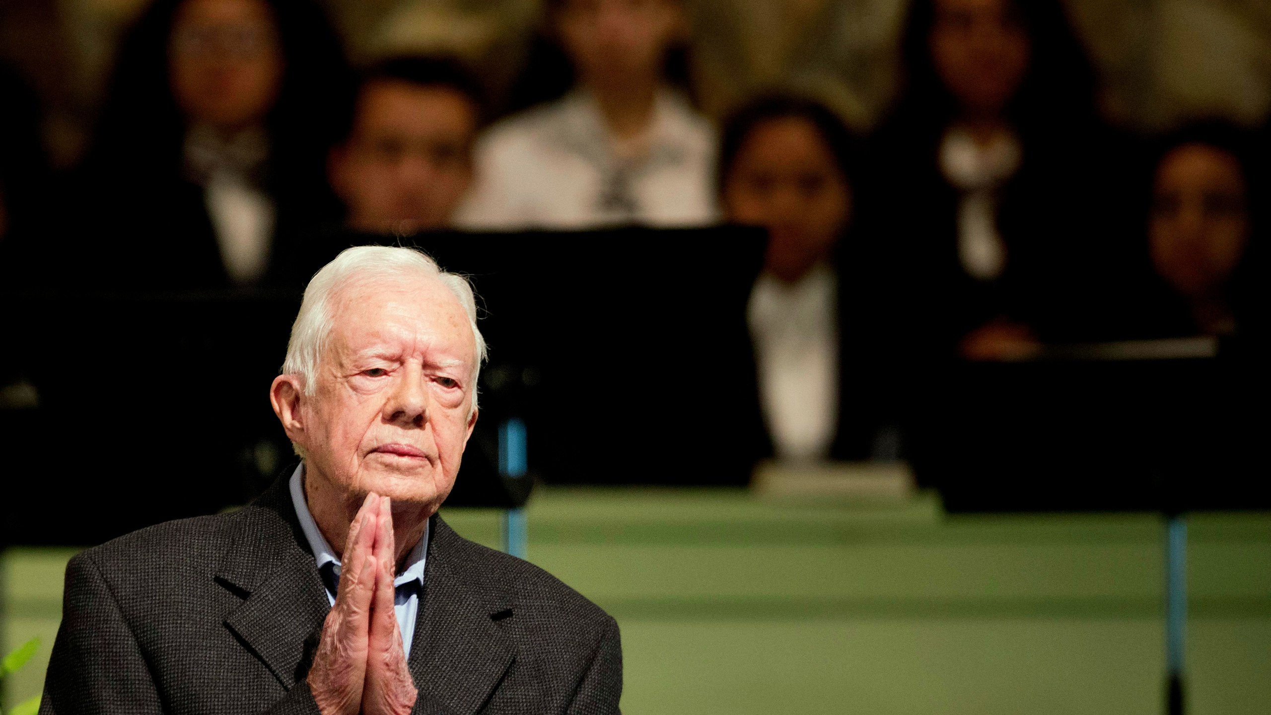 FILE - Former President Jimmy Carter teaches Sunday school class at Maranatha Baptist Church in his hometown, Aug. 23, 2015, in Plains, Ga. The 90-year-old Carter gave one lesson to about 300 people filling the small Baptist church that he and his wife, Rosalynn, attend. It was Carter's first lesson since detailing the intravenous drug doses and radiation treatment planned to treat melanoma found in his brain after surgery to remove a tumor from his liver. (AP Photo/David Goldman, File)