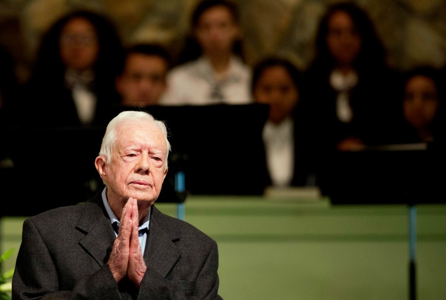 FILE - Former President Jimmy Carter teaches Sunday school class at Maranatha Baptist Church in his hometown, Aug. 23, 2015, in Plains, Ga. The 90-year-old Carter gave one lesson to about 300 people filling the small Baptist church that he and his wife, Rosalynn, attend. It was Carter's first lesson since detailing the intravenous drug doses and radiation treatment planned to treat melanoma found in his brain after surgery to remove a tumor from his liver. (AP Photo/David Goldman, File)