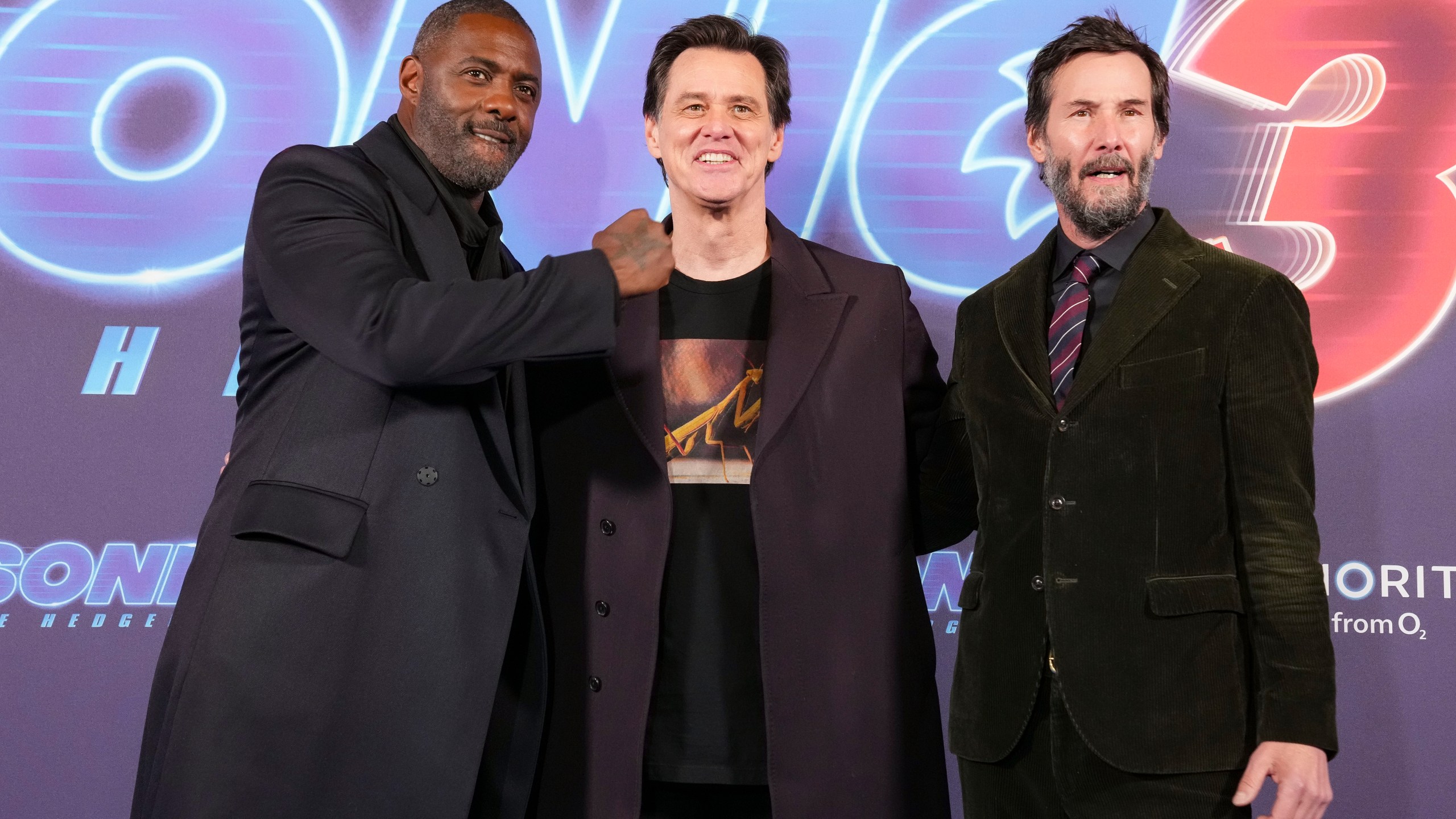 Idris Elba, from left, Jim Carrey and Keanu Reeves pose together for photographers upon arrival at the premiere of the film 'Sonic the Hedgehog 3' in London, on Tuesday, Dec. 10, 2024. (Photo by Scott A Garfitt/Invision/AP)