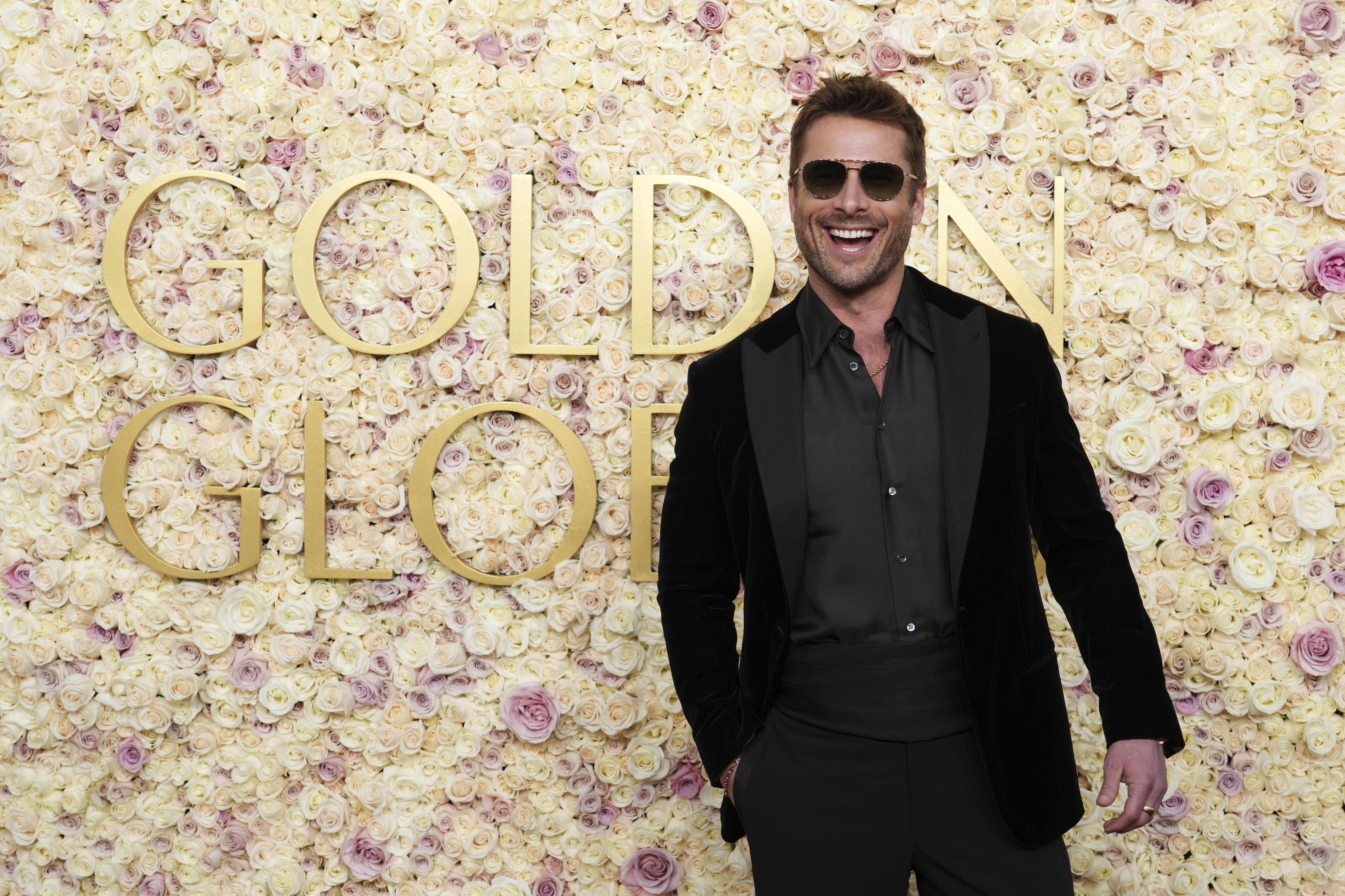 Glen Powell arrives at the 82nd Golden Globes on Sunday, Jan. 5, 2025, at the Beverly Hilton in Beverly Hills, Calif. (Photo by Jordan Strauss/Invision/AP)