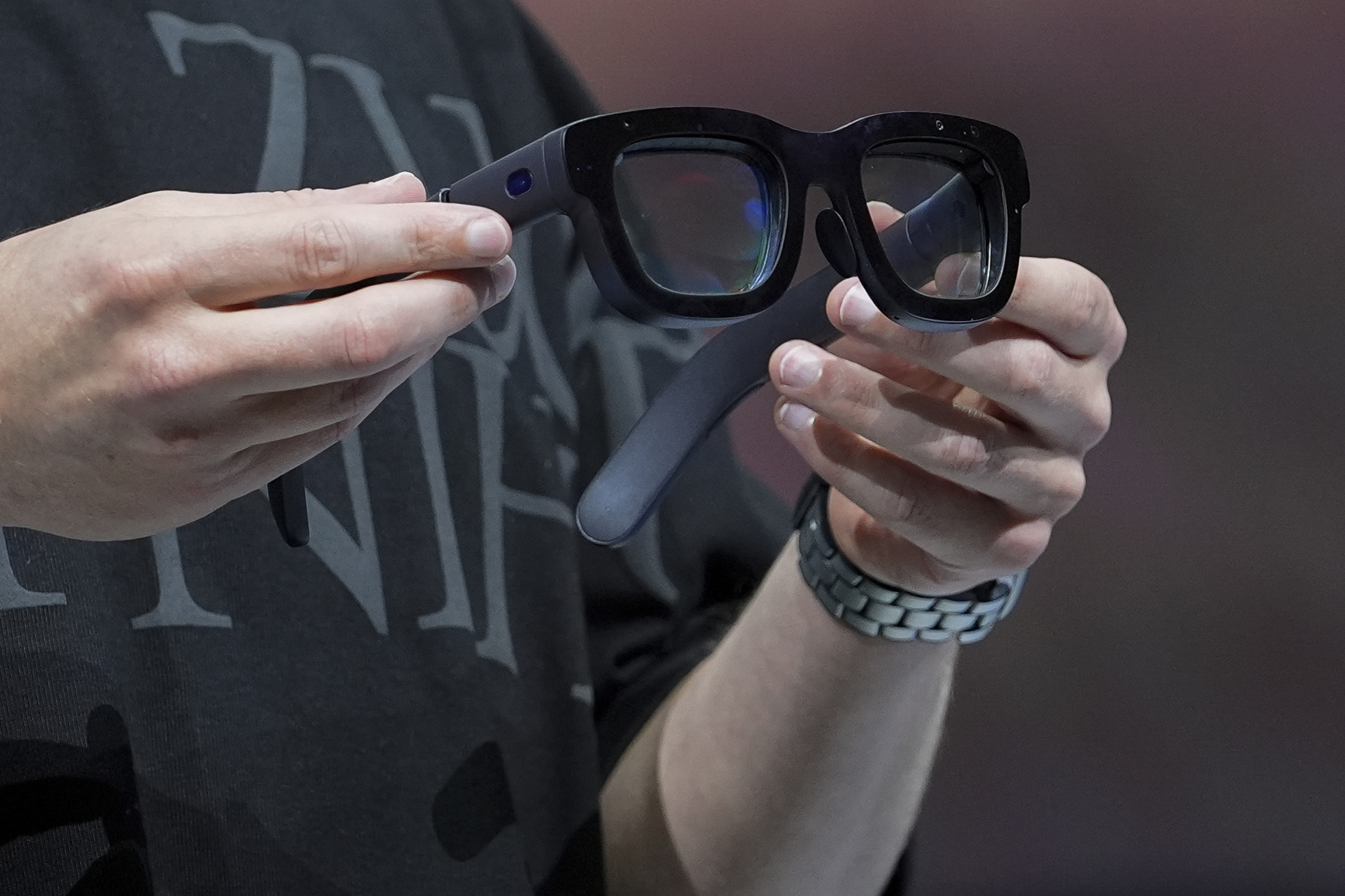 FILE - Mark Zuckerberg holds a pair of Orion AR glasses during the Meta Connect conference, on Sept. 25, 2024, in Menlo Park, Calif. (AP Photo/Godofredo A. Vásquez, File)