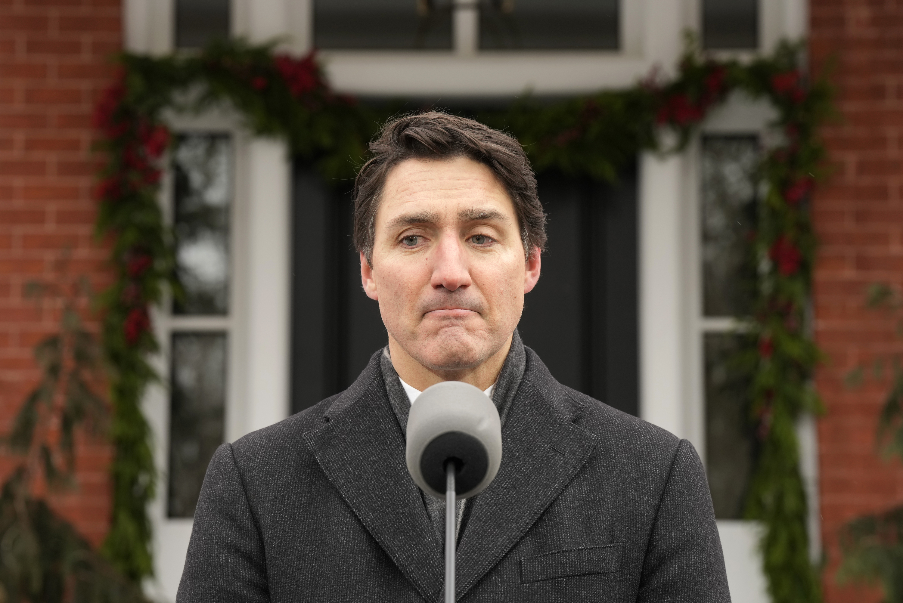 Canada Prime Minister Justin Trudeau makes an announcement outside Rideau Cottage in Ottawa on Monday, Jan. 6, 2025. (Adrian Wyld/The Canadian Press via AP)