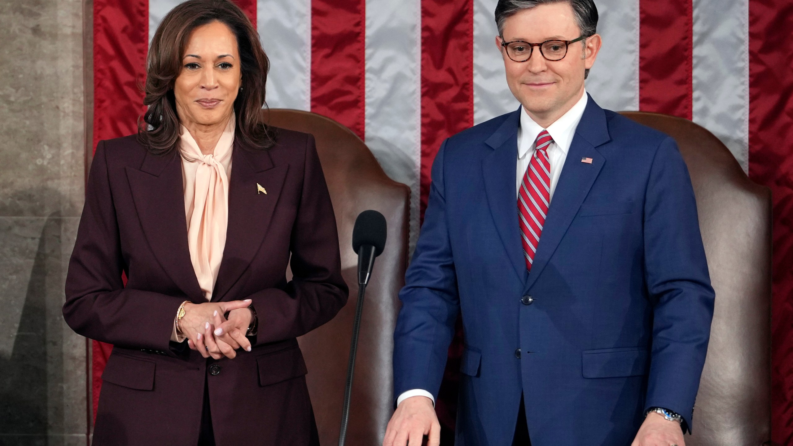 Vice President Kamala Harris stands with House Speaker Mike Johnson of La., as a joint session of Congress convenes to confirm the Electoral College votes, affirming President-elect Donald Trump's victory in the presidential election, Monday, Jan. 6, 2025, at the U.S. Capitol in Washington. (AP Photo/Matt Rourke)