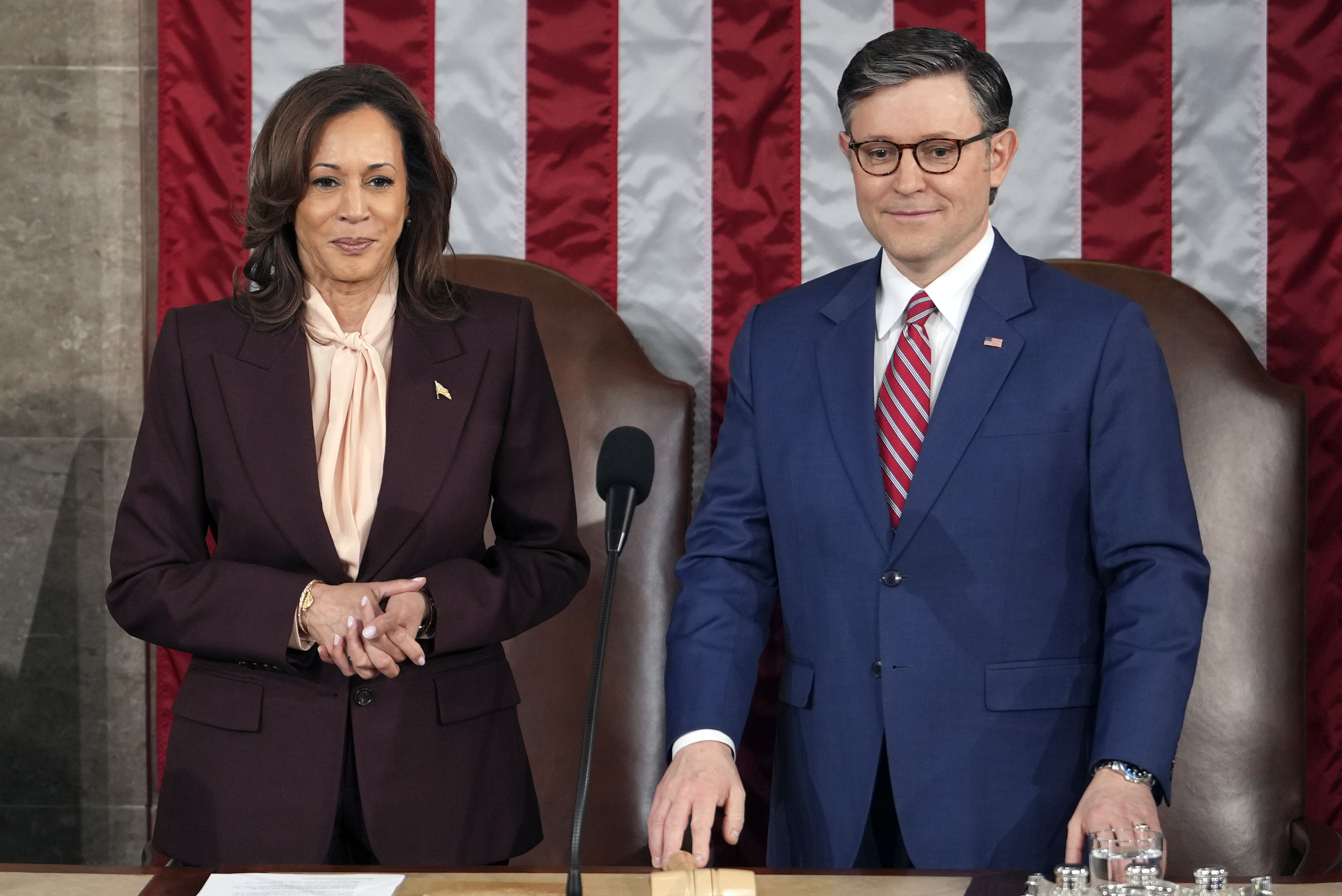 Vice President Kamala Harris stands with House Speaker Mike Johnson of La., as a joint session of Congress convenes to confirm the Electoral College votes, affirming President-elect Donald Trump's victory in the presidential election, Monday, Jan. 6, 2025, at the U.S. Capitol in Washington. (AP Photo/Matt Rourke)