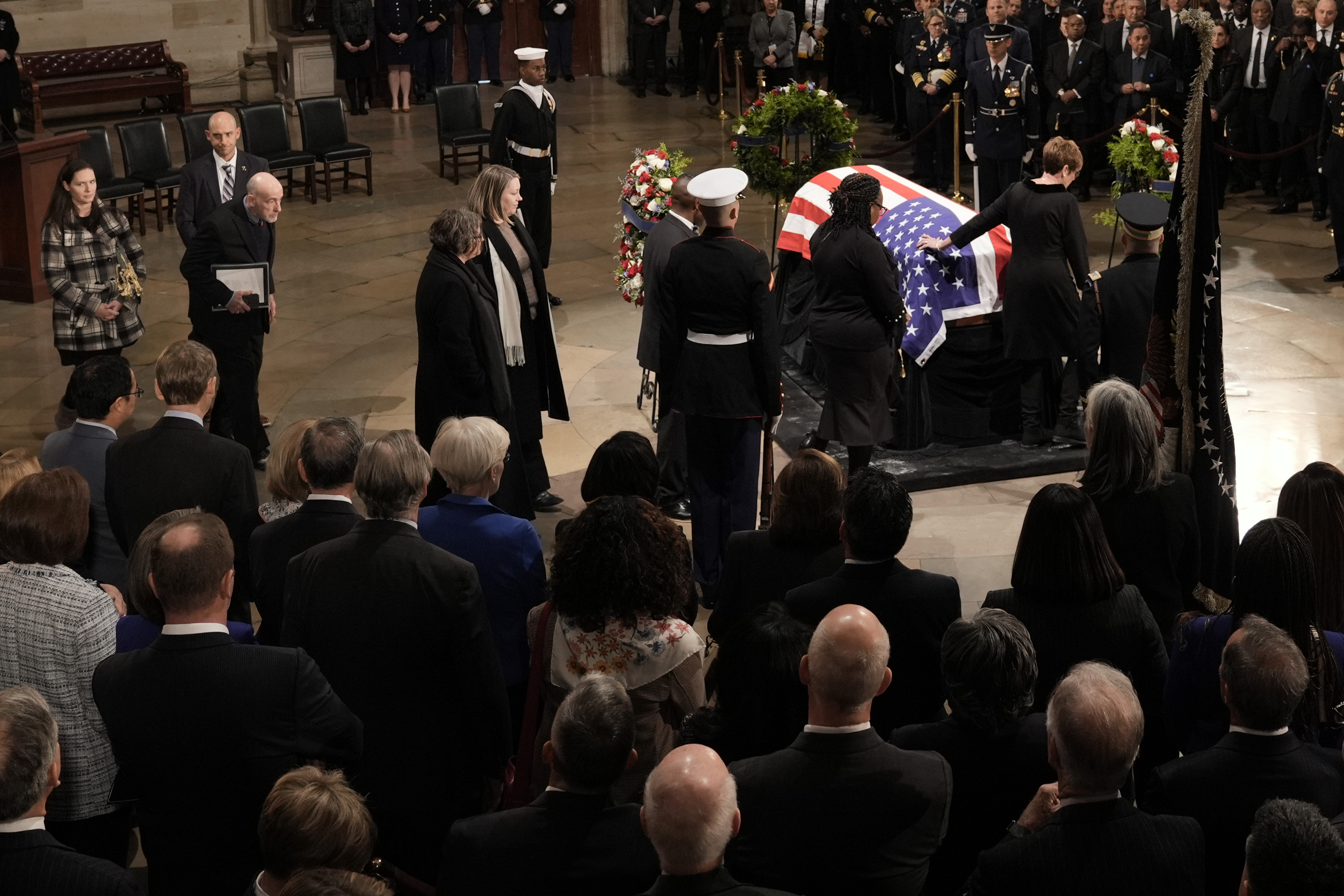 Members of the Carter family pay their respects as the flag-draped casket of former President Jimmy Carter lies in state at the U.S. Capitol, Tuesday, Jan. 7, 2025, in Washington. Carter died Dec. 29 at the age of 100. (AP Photo/J. Scott Applewhite, Pool)