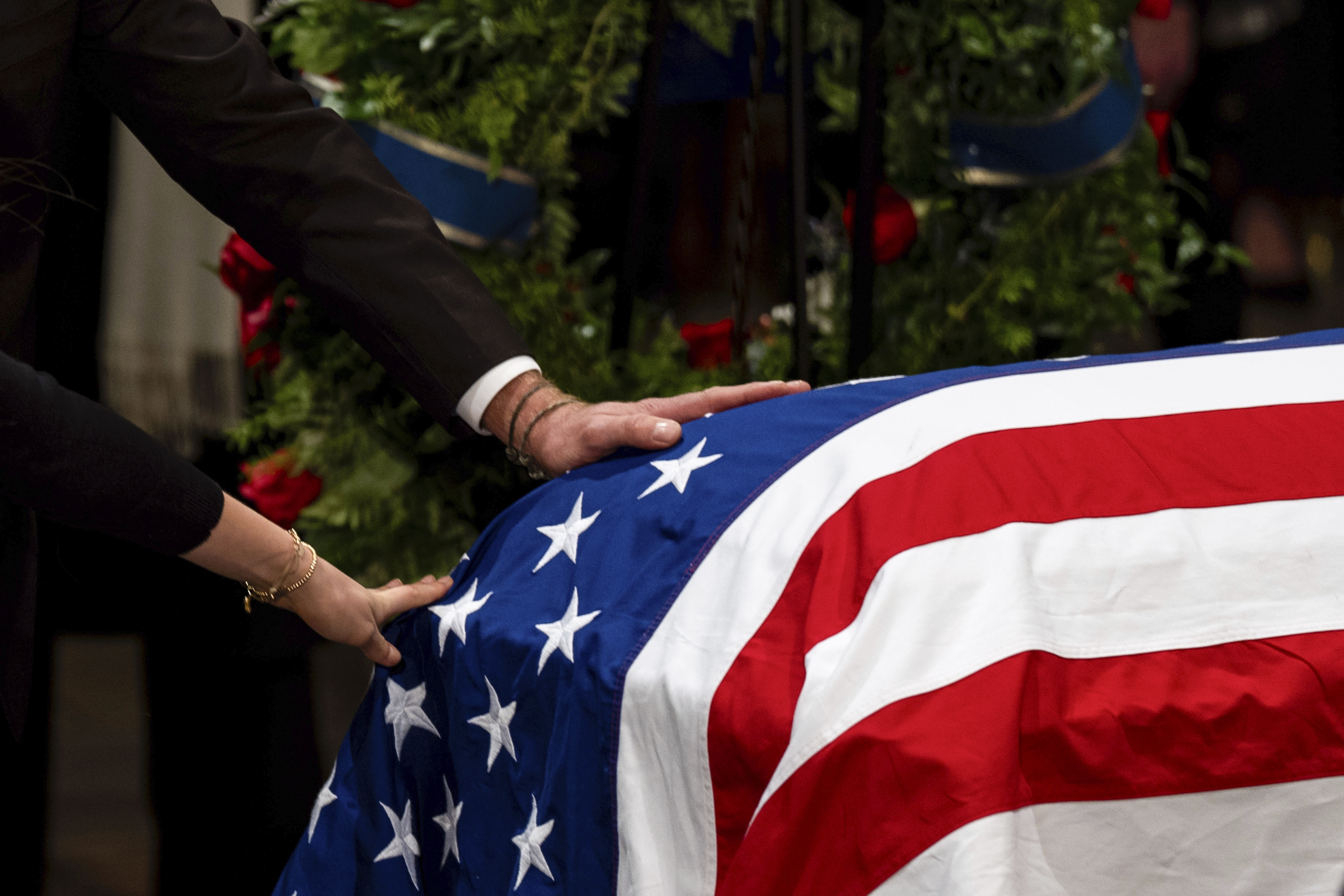 The Carter family pay their respects during a ceremony as the flag-draped casket of former President Jimmy Carter lies in state, at the Capitol, Tuesday, Jan. 7, 2025, in Washington. Carter died Dec. 29 at the age of 100. (Kent Nishimura/The New York Times via AP, Pool)