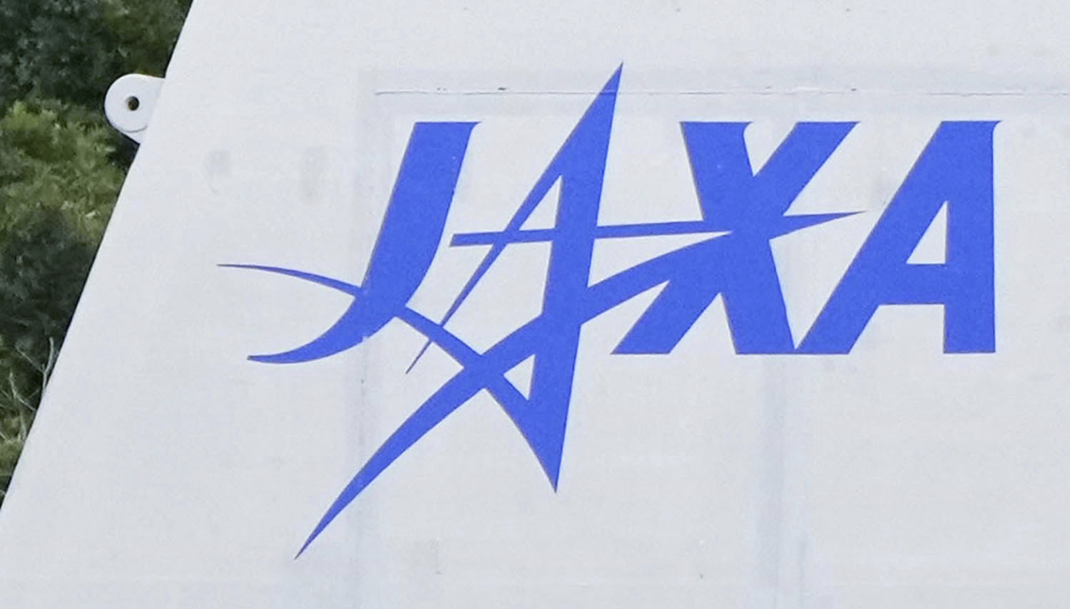 FILE - The logo of the Japan Aerospace Exploration Agency, or JAXA, is seen at its Tanegashima Space Center in Minamitanecho, Kagoshima prefecture, Feb. 16, 2024. (Kyodo News via AP, File)