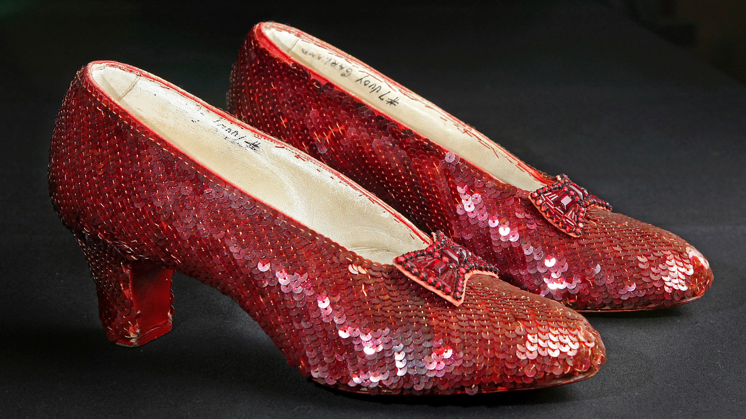 FILE - Sequin-covered ruby slippers worn by Judy Garland in "The Wizard of Oz" appear at the offices of Profiles in History in Calabasas, Calif. on Nov. 9, 2001. (AP Photo/Reed Saxon, File)