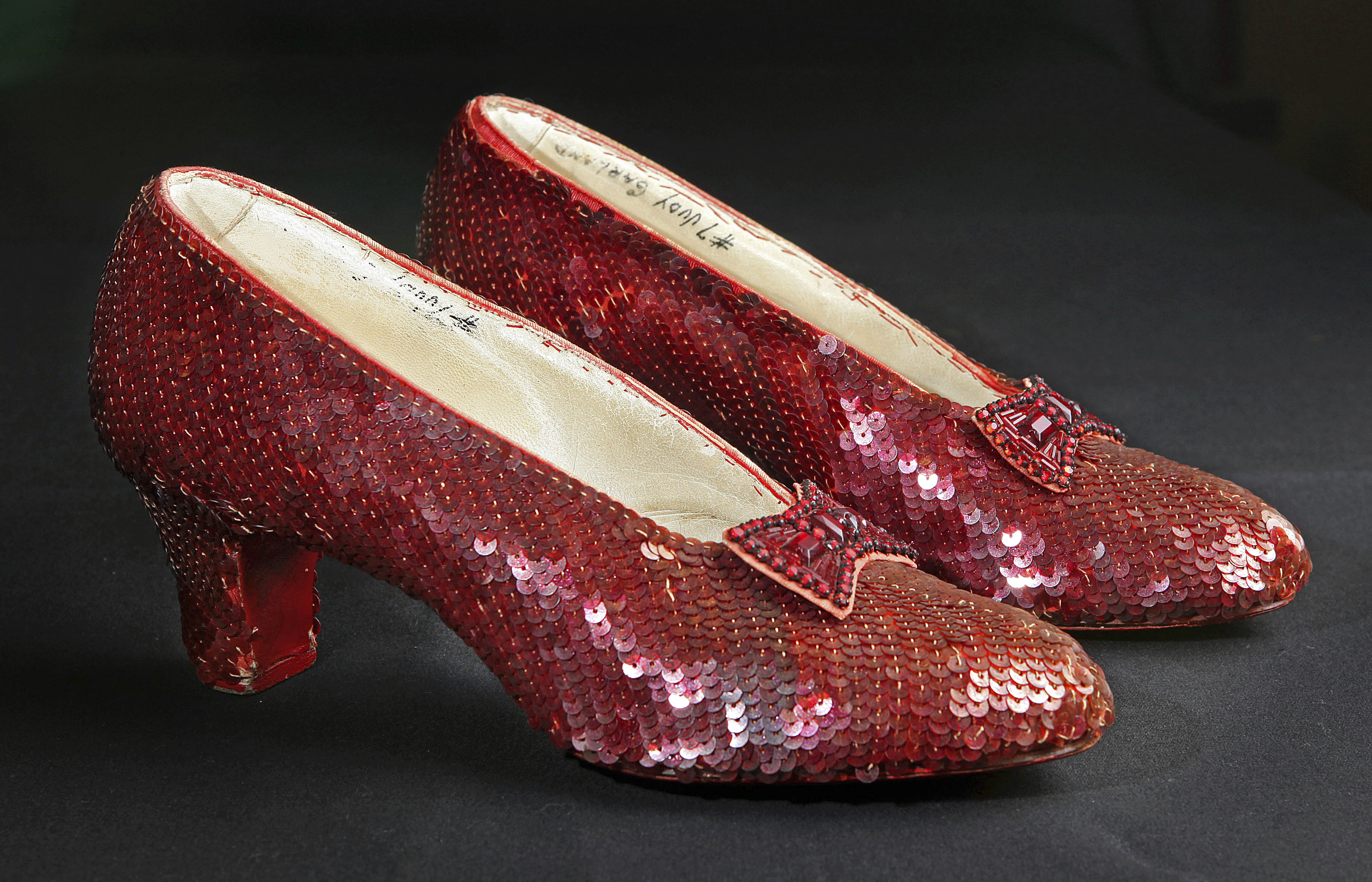 FILE - Sequin-covered ruby slippers worn by Judy Garland in "The Wizard of Oz" appear at the offices of Profiles in History in Calabasas, Calif. on Nov. 9, 2001. (AP Photo/Reed Saxon, File)