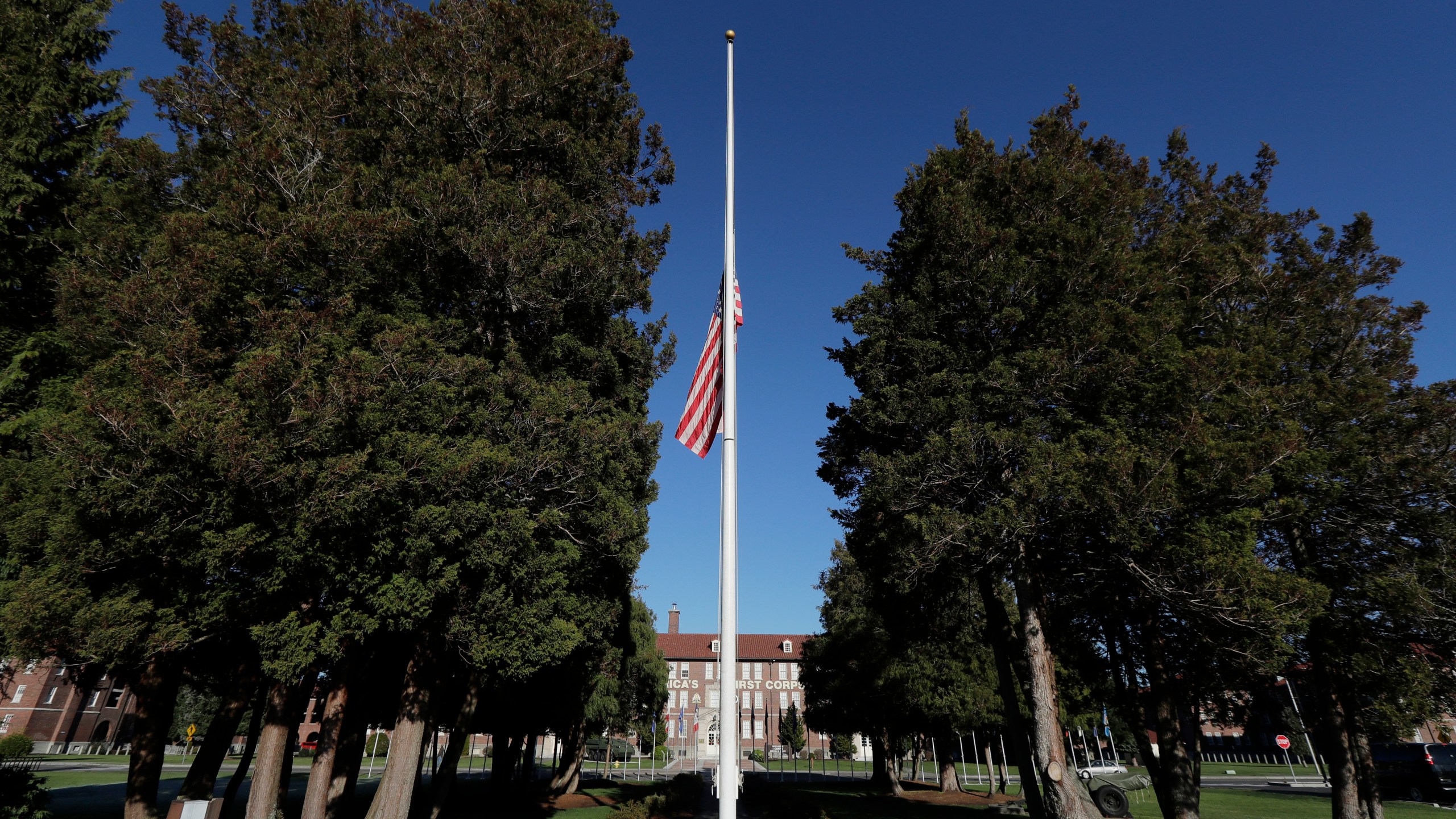 FILE - The main flag pole in front of the U.S. Army I Corps headquarters on Joint Base Lewis-McChord, south of Tacoma, Wash., hangs at half-staff, Wednesday, Dec. 5, 2018. (AP Photo/Ted S. Warren, File)