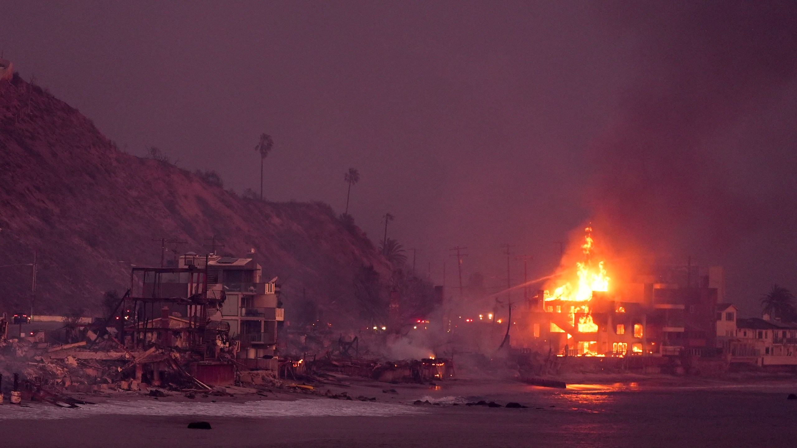 Beach front homes are destroyed by the Palisades Fire Wednesday, Jan. 8, 2025 in Malibu, Calif. (AP Photo/Mark J. Terrill)