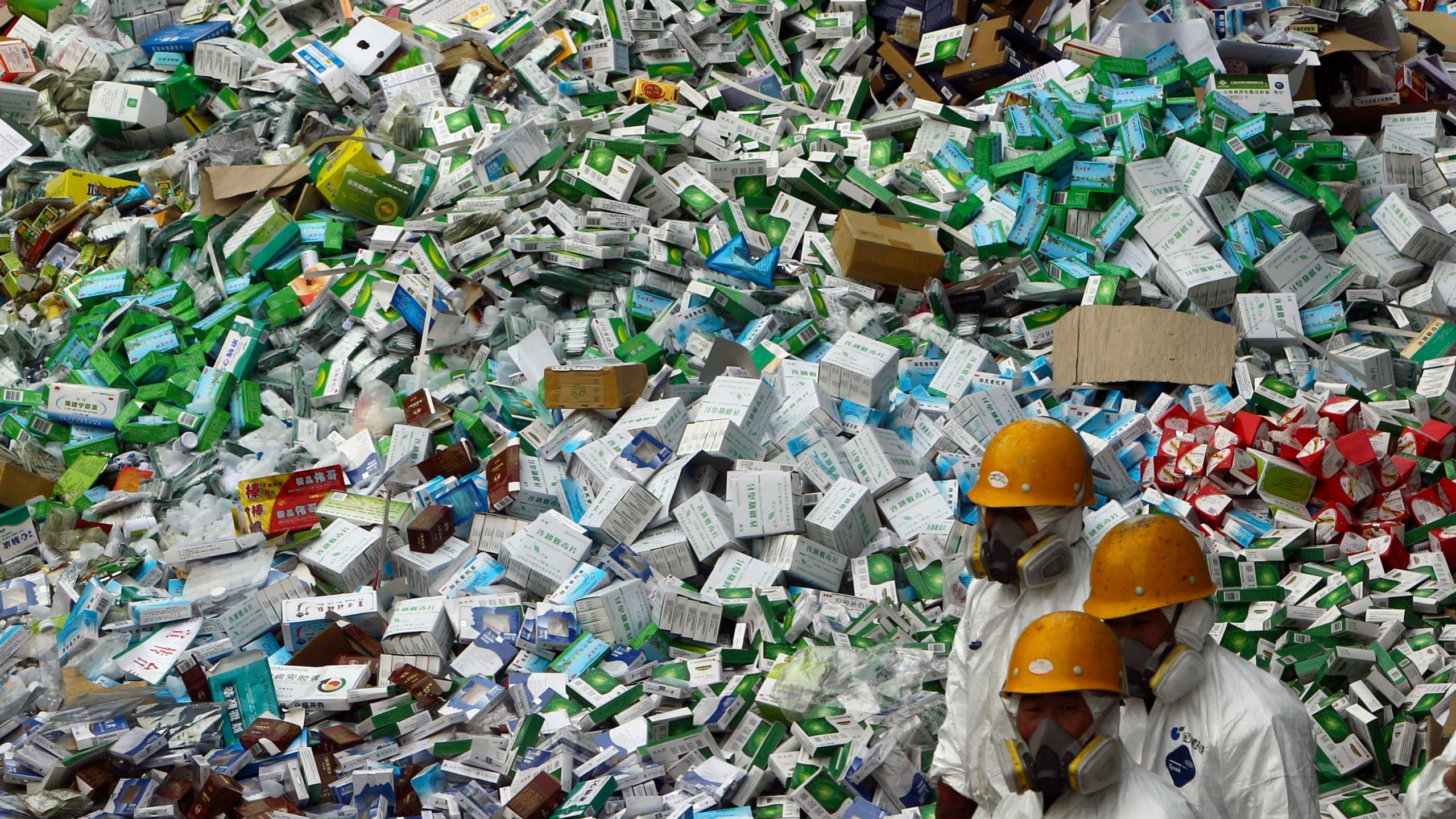 FILE - Workers prepare to destroy over 50 tons of confiscated fake medicine during a campaign to mark World Consumer Rights Day in Beijing, Thursday March 15, 2012. (AP Photo/File)