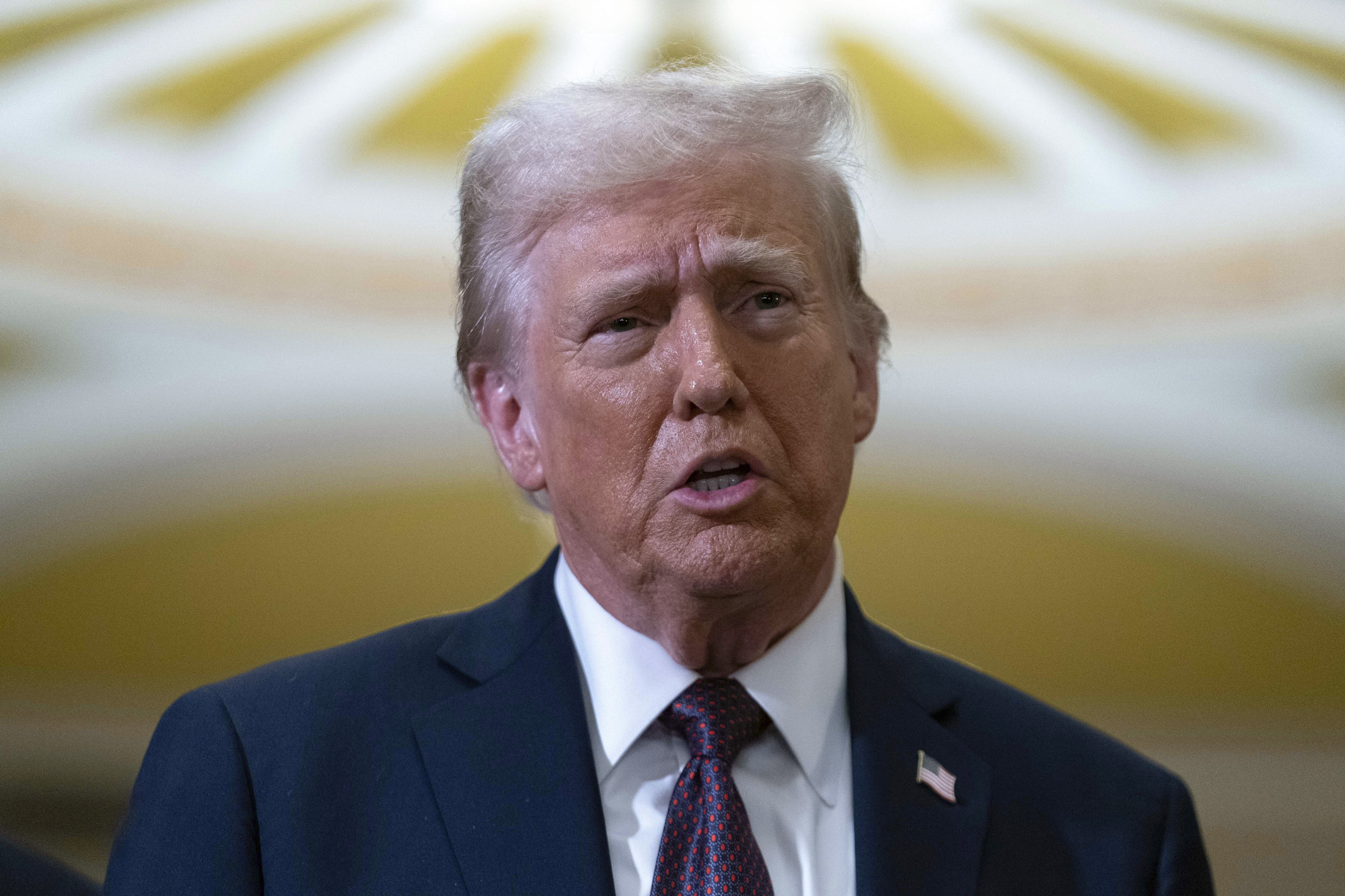 President-elect Donald Trump talks to reporters after a meeting with Republican leadership at the Capitol on Wednesday, Jan. 8, 2025, in Washington. (AP Photo/Jose Luis Magana)