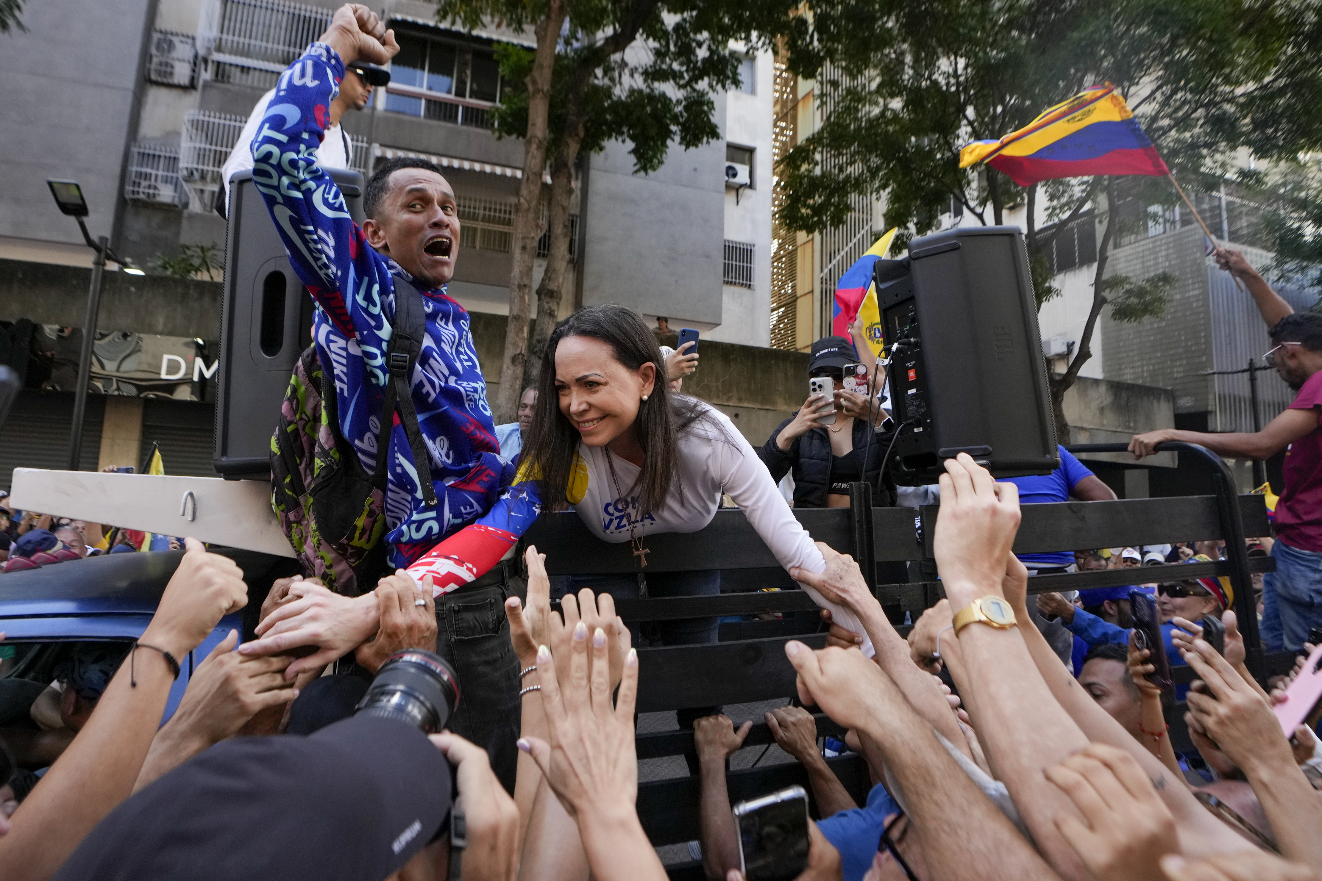 Opposition leader Maria Corina Machado greets supporters during a protest against Venezuelan President Nicolas Maduro the day before his inauguration for a third term in Caracas, Venezuela, Thursday, Jan. 9, 2025. (AP Photo/Matias Delacroix)