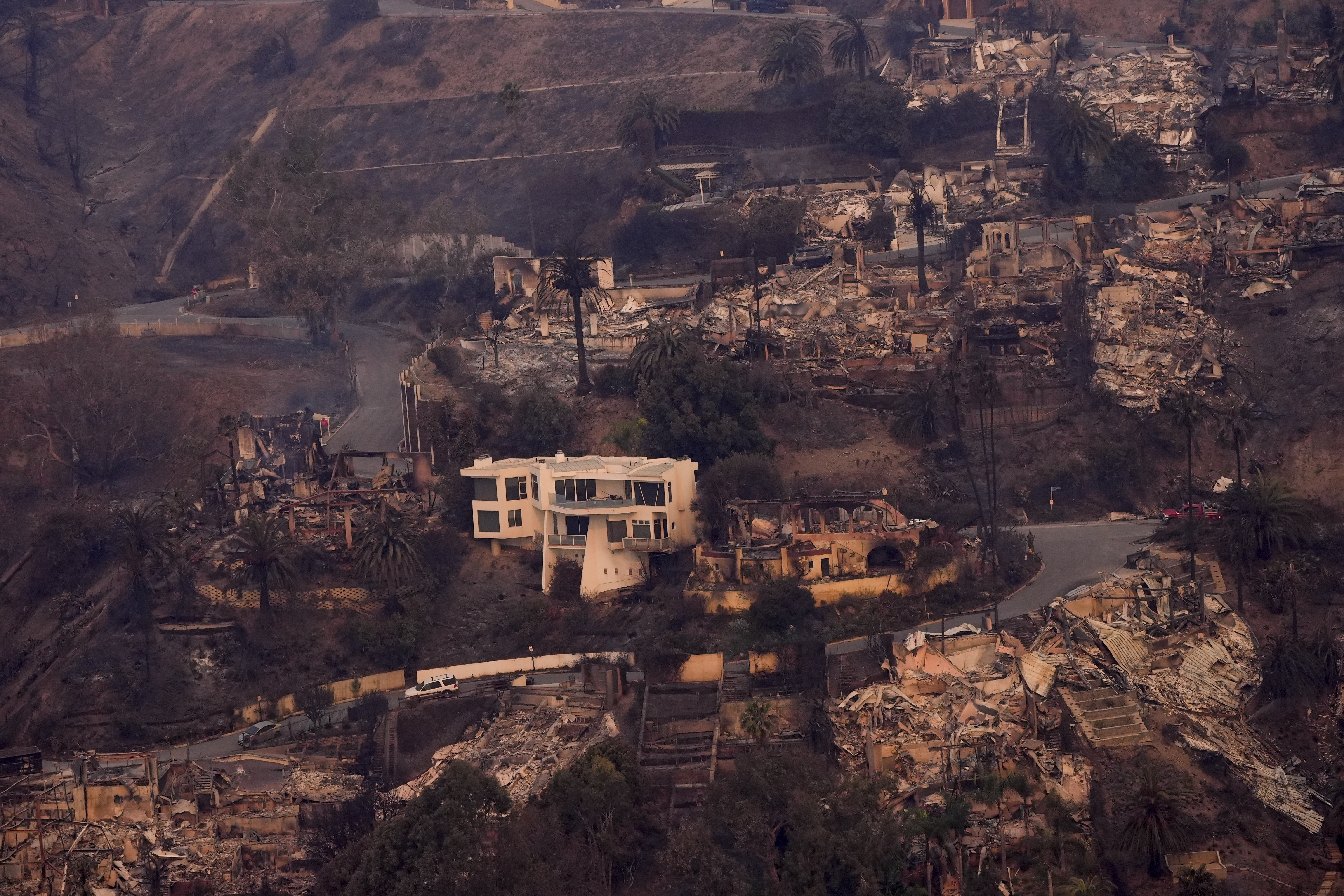 The devastation from the Palisades Fire is seen from the air in the Pacific Palisades neighborhood of Los Angeles, Thursday, Jan. 9, 2025. (AP Photo/Mark J. Terrill)