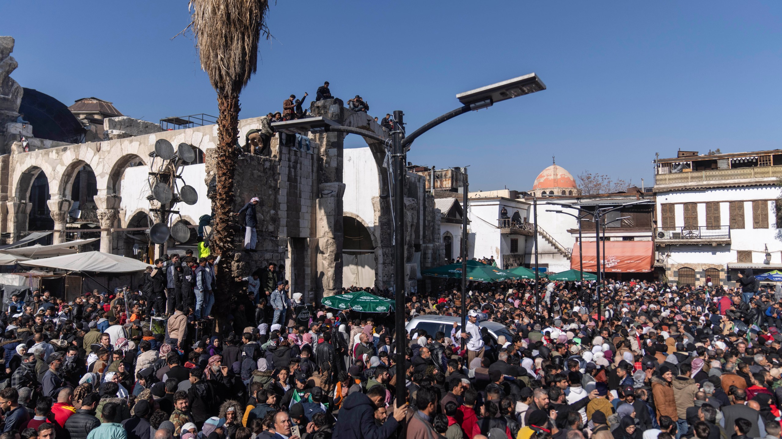 People gather to enter Umayyad Mosque for Friday prayers, in Damascus, Syria, Friday, Jan. 10, 2025. (AP Photo/Mosa'ab Elshamy)