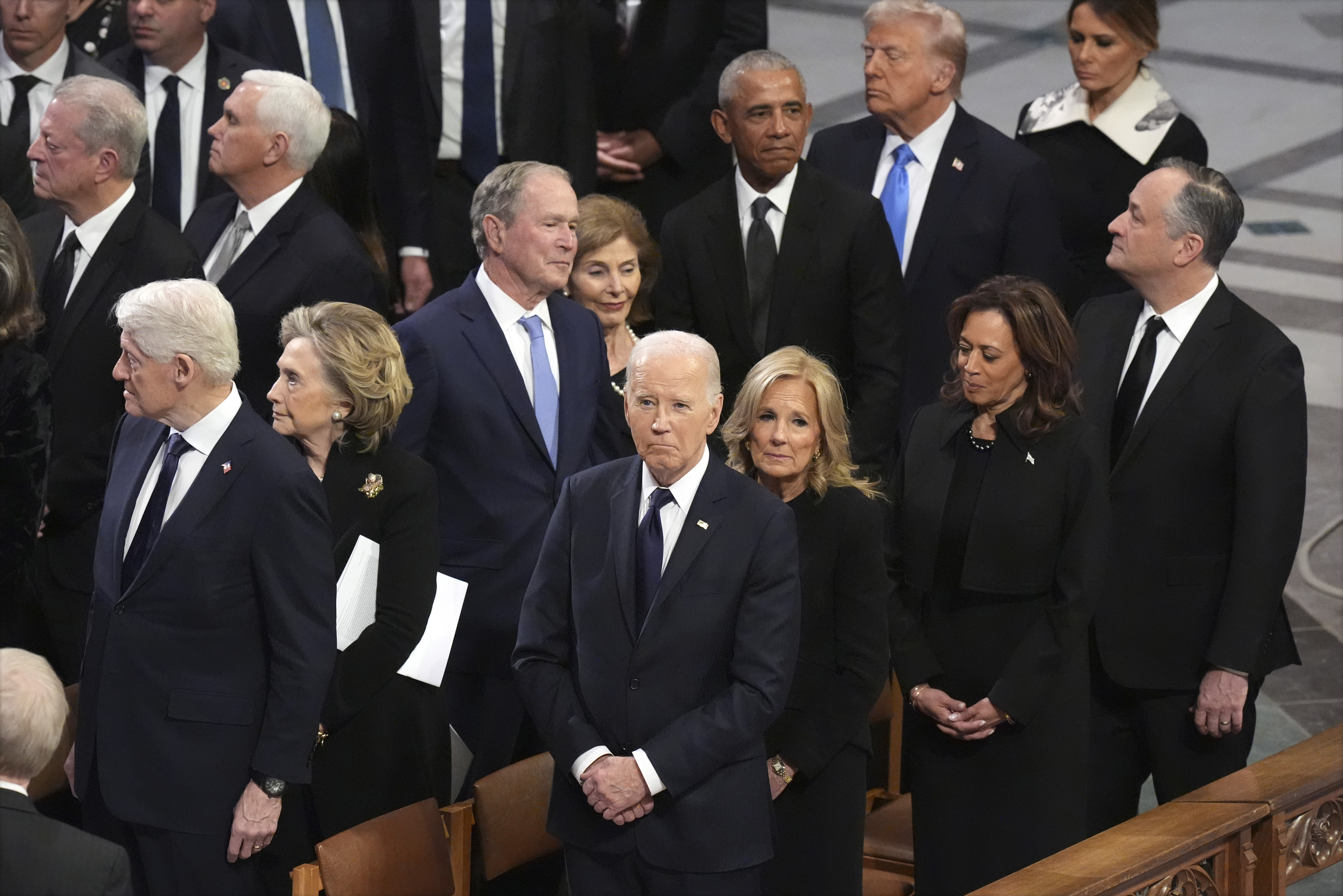 President Joe Biden and first lady Jill Biden watch as the state funeral for former President Jimmy Carter begins at Washington National Cathedral in Washington, Thursday, Jan. 9, 2025. (AP Photo/Jacquelyn Martin)