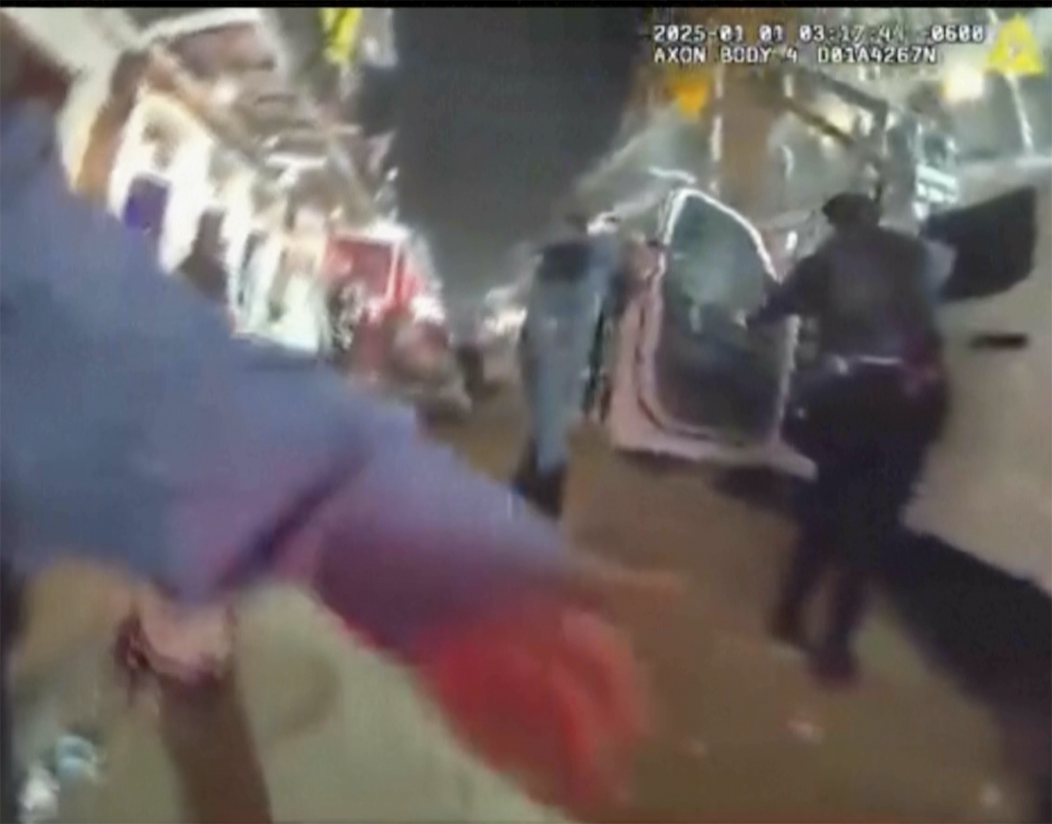 This image provided by New Orleans Police Department shows police body camera footage of officers approaching the white truck on New Year's Day in New Orleans on Wednesday, Jan. 1, 2025. (New Orleans Police Department via AP)