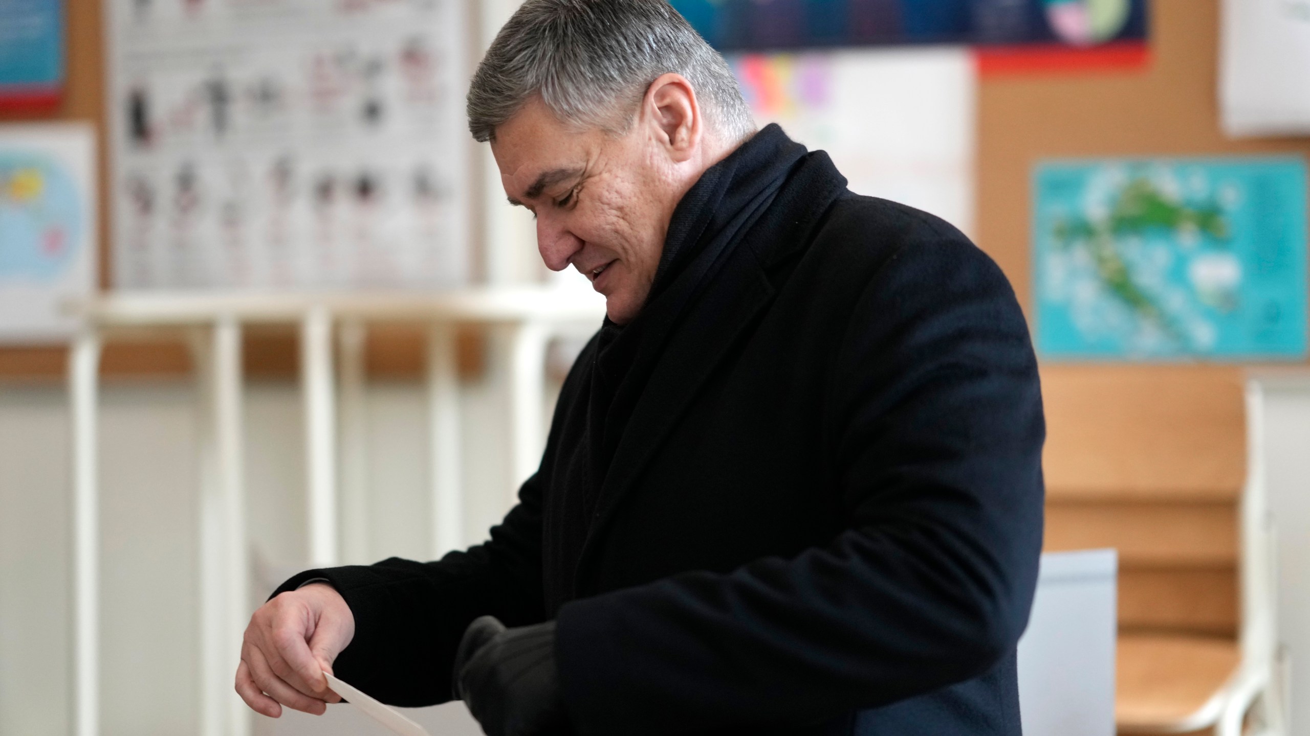 President incumbent Zoran Milanovic arrives to cast his ballot during a runoff vote for the Croatian presidential election at a polling station in Zagreb, Croatia, Sunday, Jan. 12, 2025. (AP Photo/Darko Bandic)