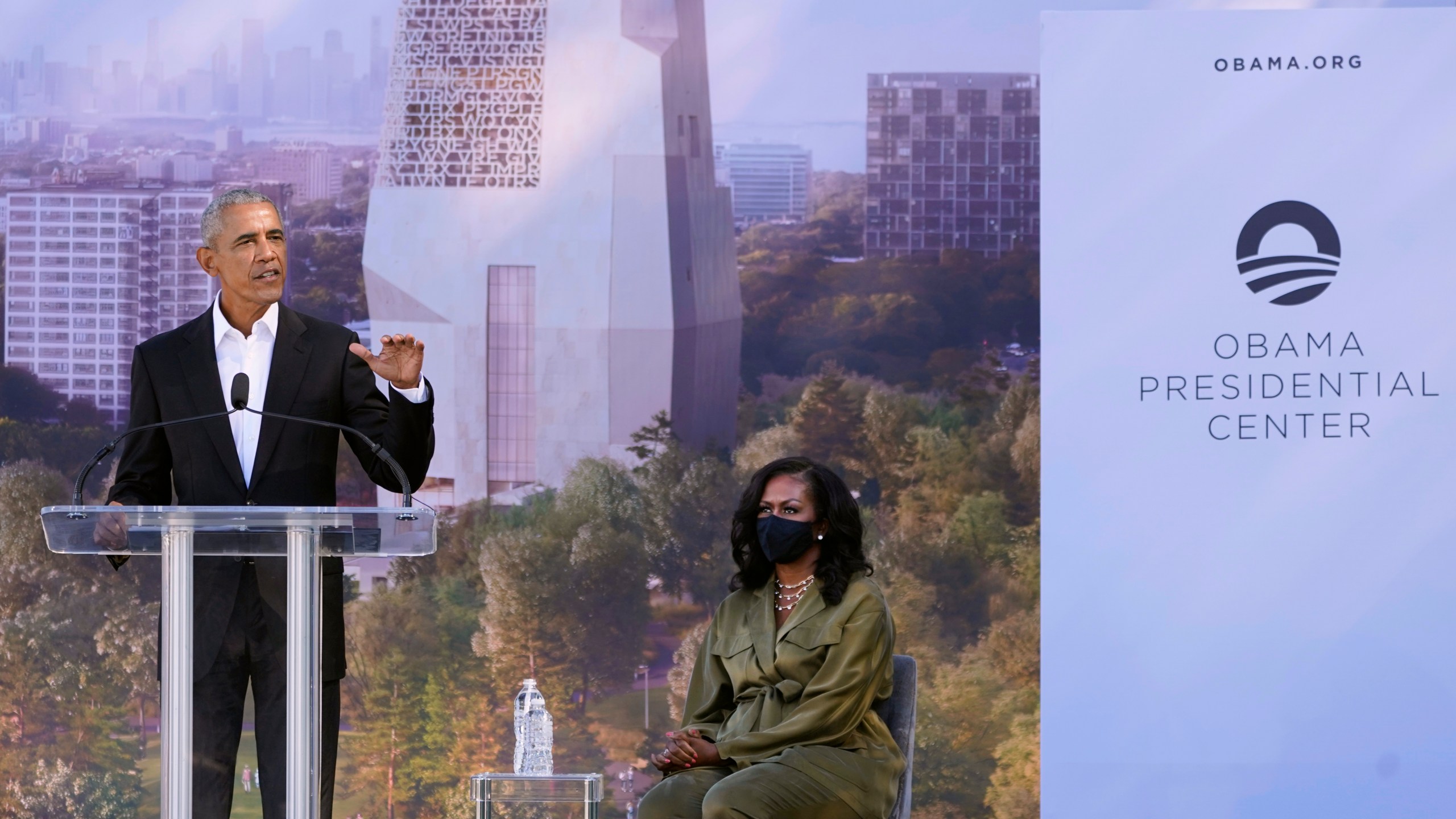 FILE - Former President Barack Obama speaks as former first lady Michelle Obama listens during a groundbreaking ceremony for the Obama Presidential Center, Sept. 28, 2021, in Chicago. (AP Photo/Charles Rex Arbogast, File)