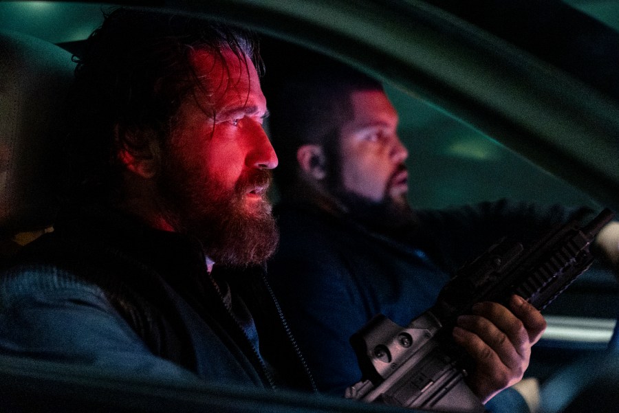 This image released by Lionsgate shows Gerard Butler, left, and O'Shea Jackson Jr. in a scene from "Den of Thieves 2: Pantera." (Rico Torres/Lionsgate via AP)