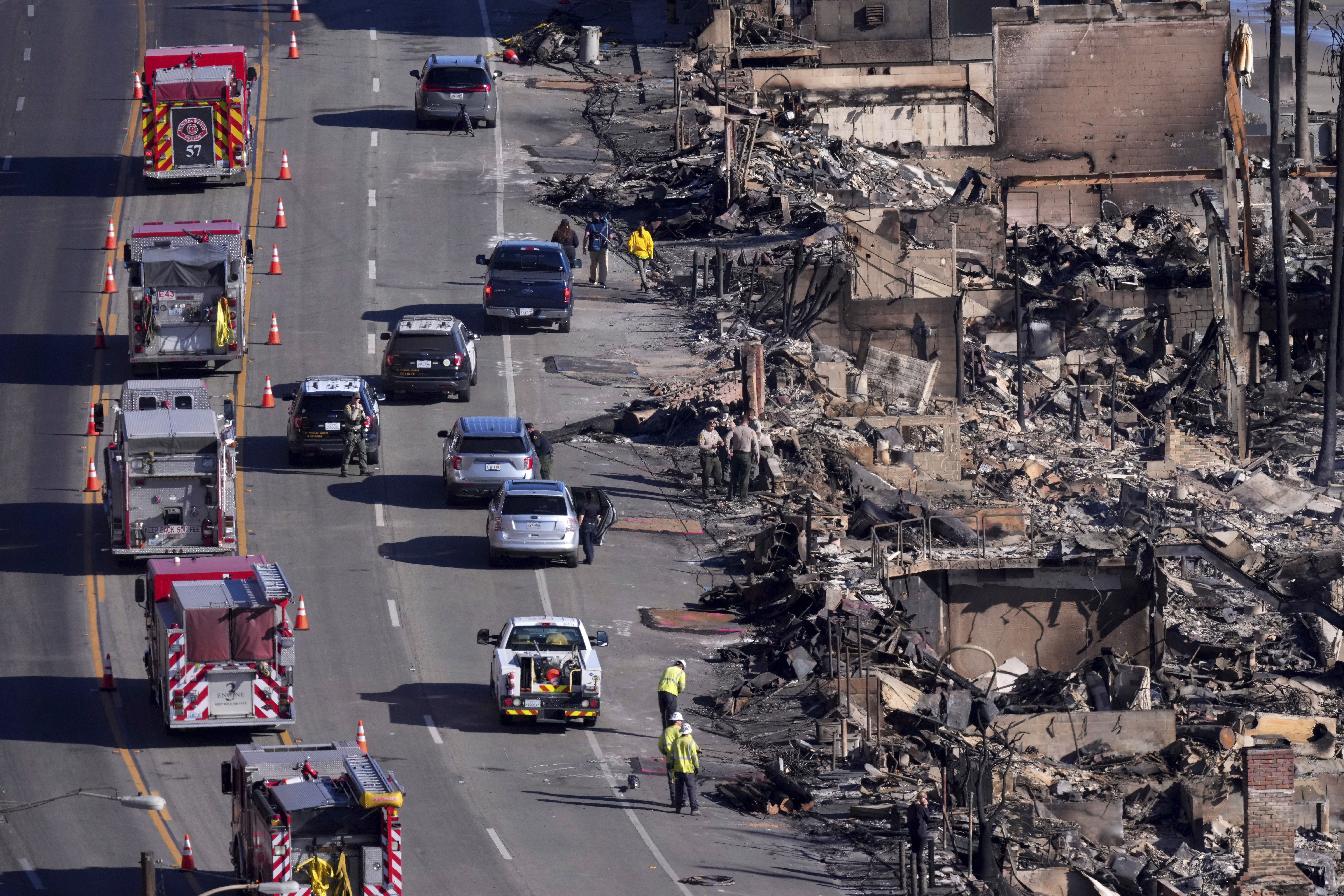 Homes along the Pacific Coast Highway are seen burned by the Palisades Fire, Sunday, Jan. 12, 2025, in Malibu, Calif. (AP Photo/Mark J. Terrill)